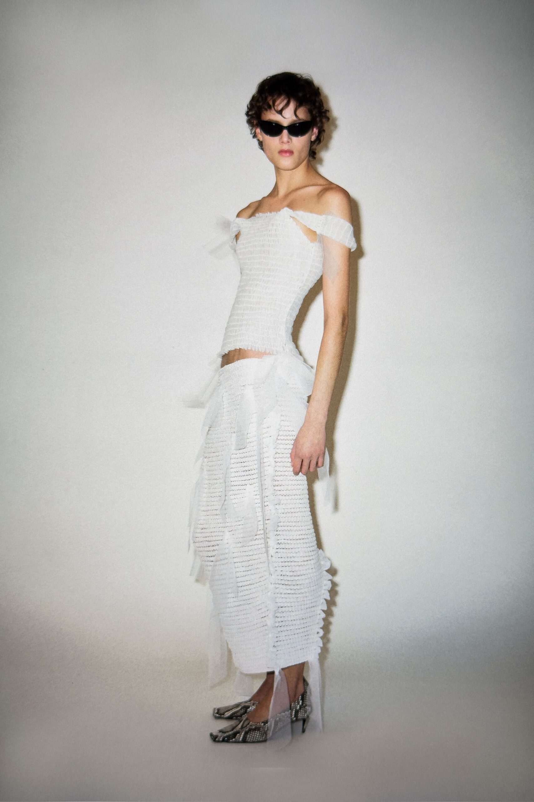 white cotton sleeveless off-shoulder fitted pleated layered dress