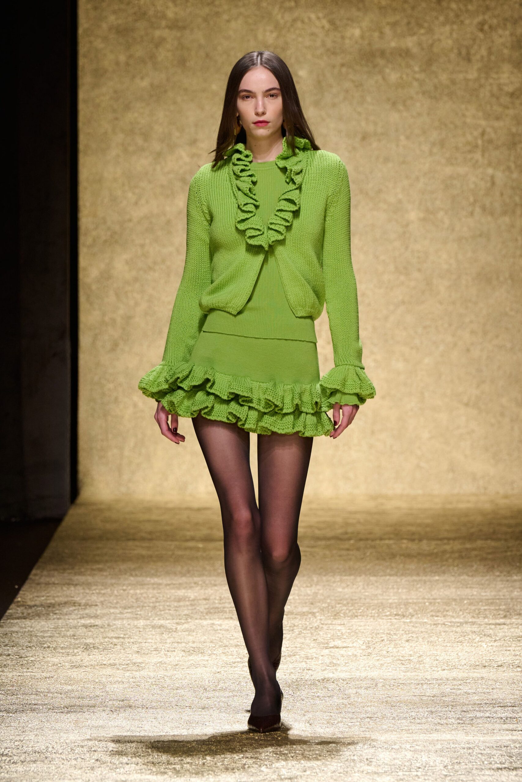 green ruffled top and mini skirt