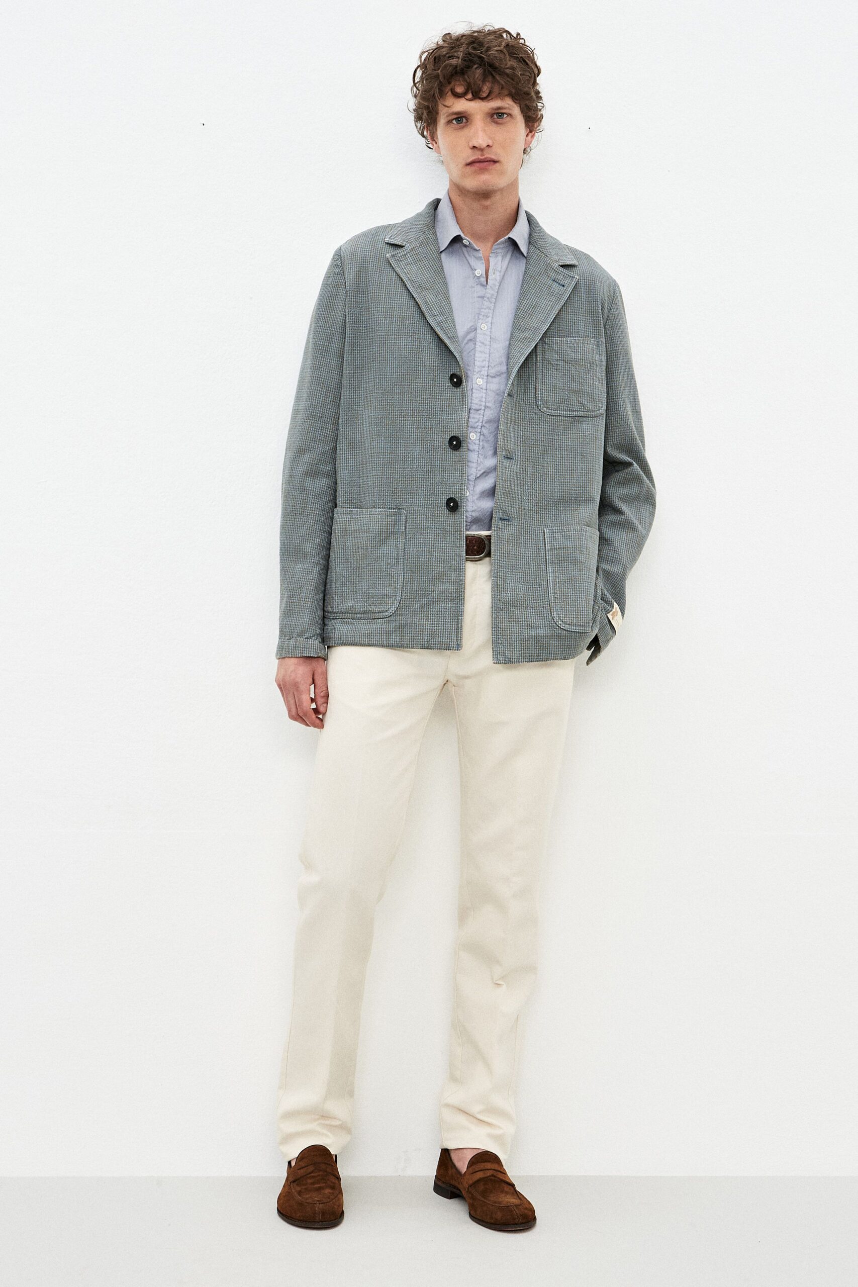 blue cotton jacket with beige pants