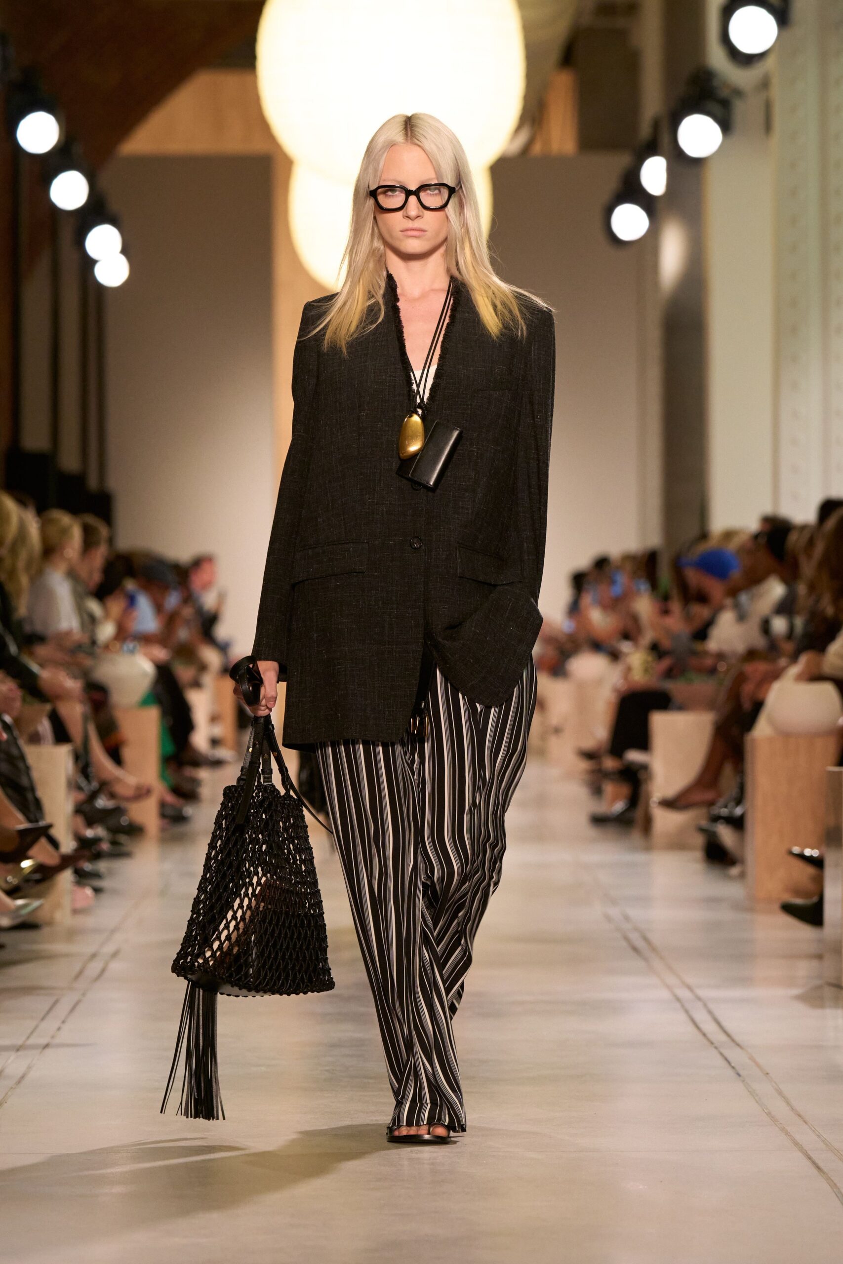 black tailored blazer with striped pants