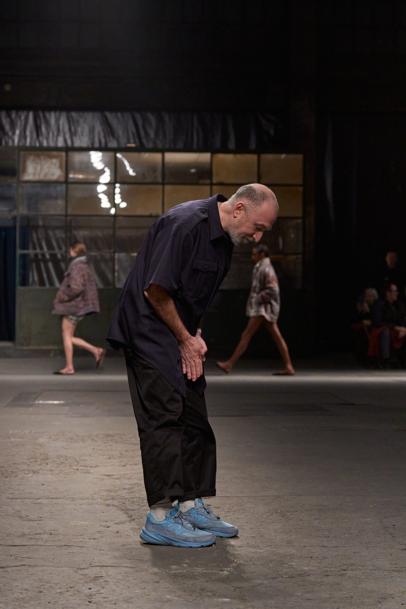 black relaxed shirt and pants with blue shoes