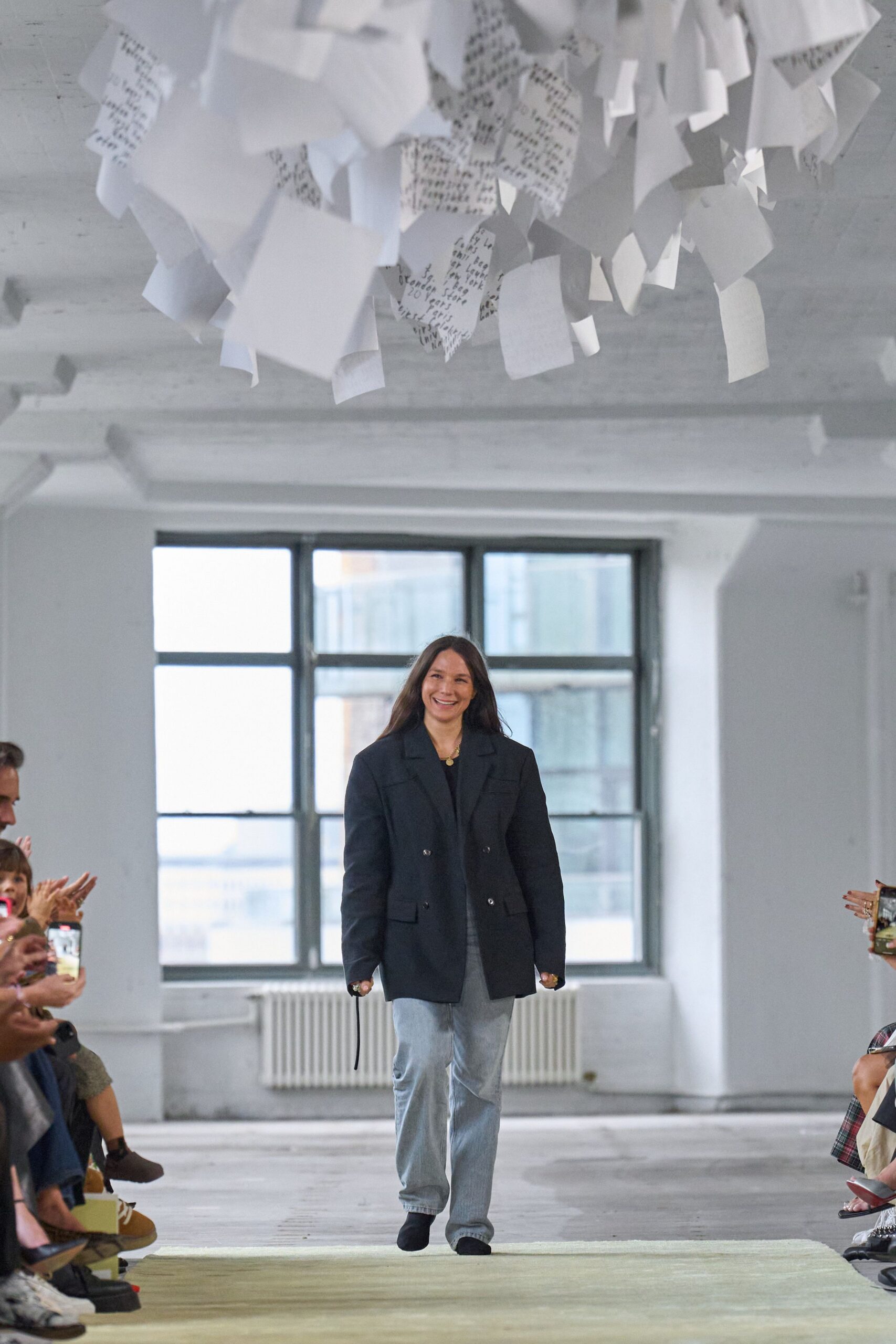 black blazer gray shirt light blue pants