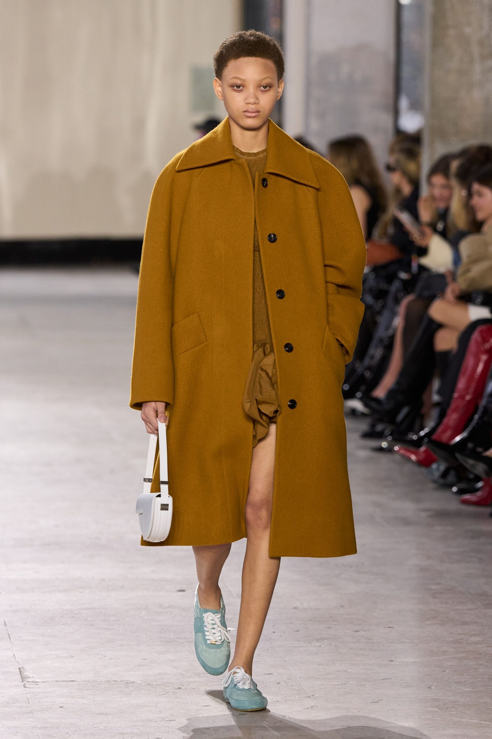 brown wool coat beige dress blue shoes