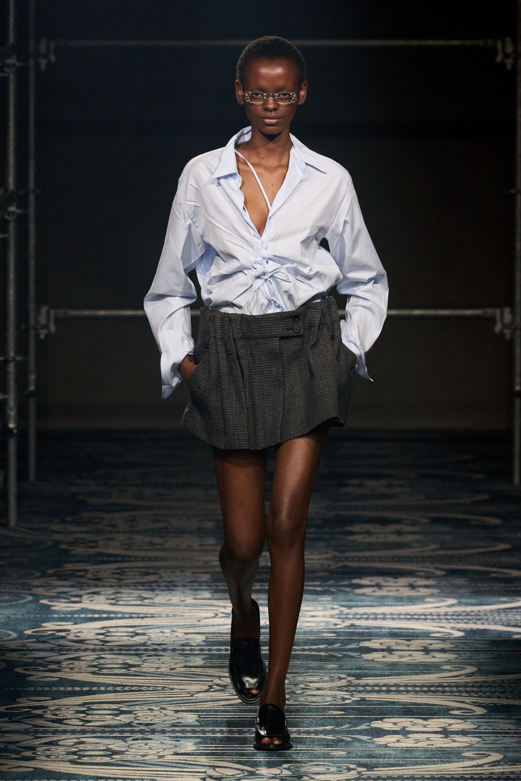 blue relaxed shirt gray pleated skirt