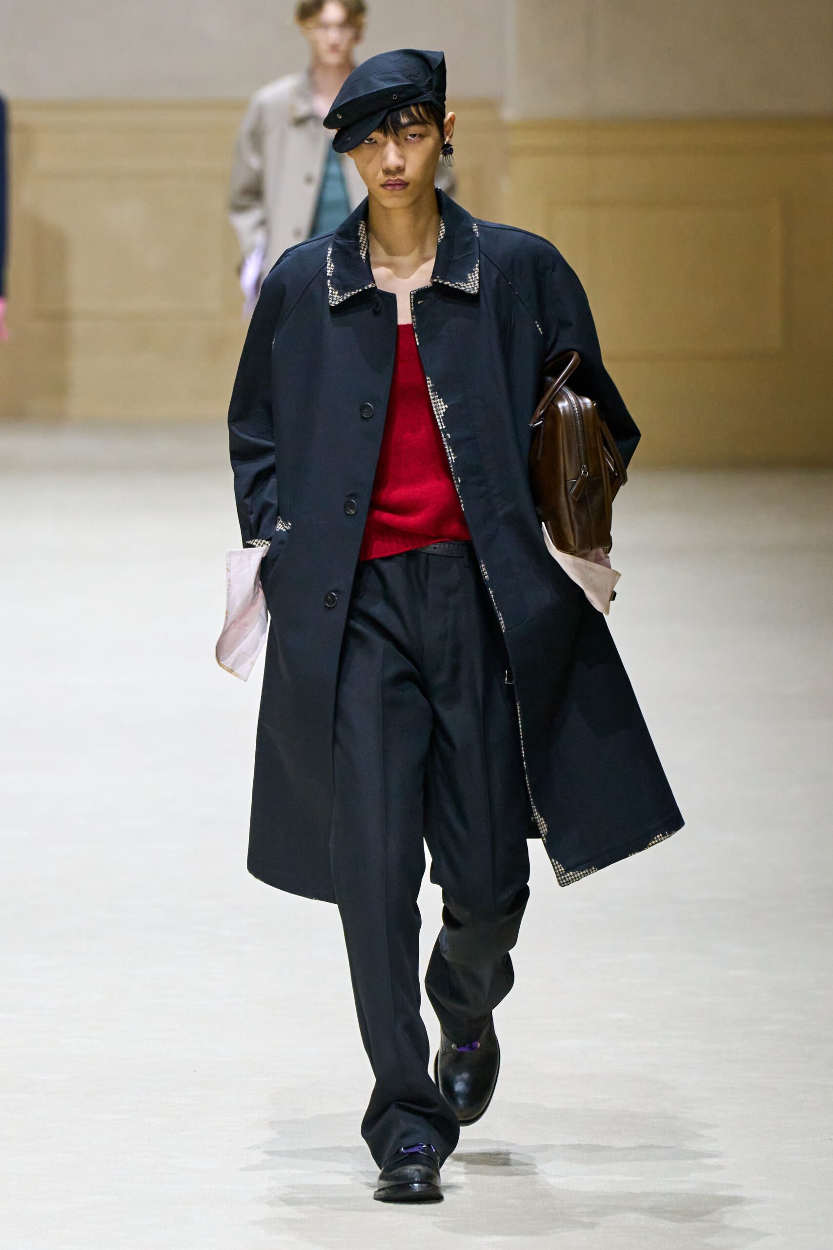 black coat red sweater tailored pants