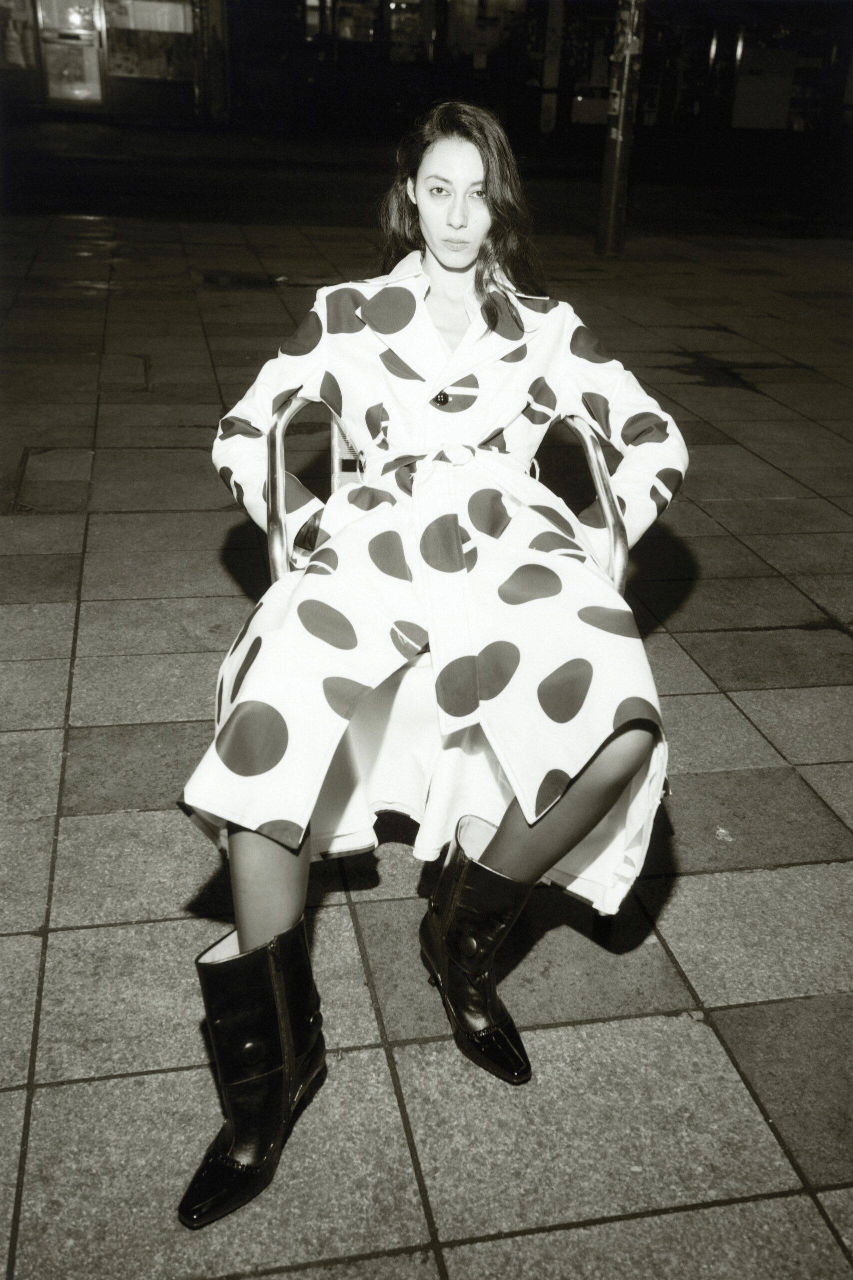 polka-dot trench coat and black boots