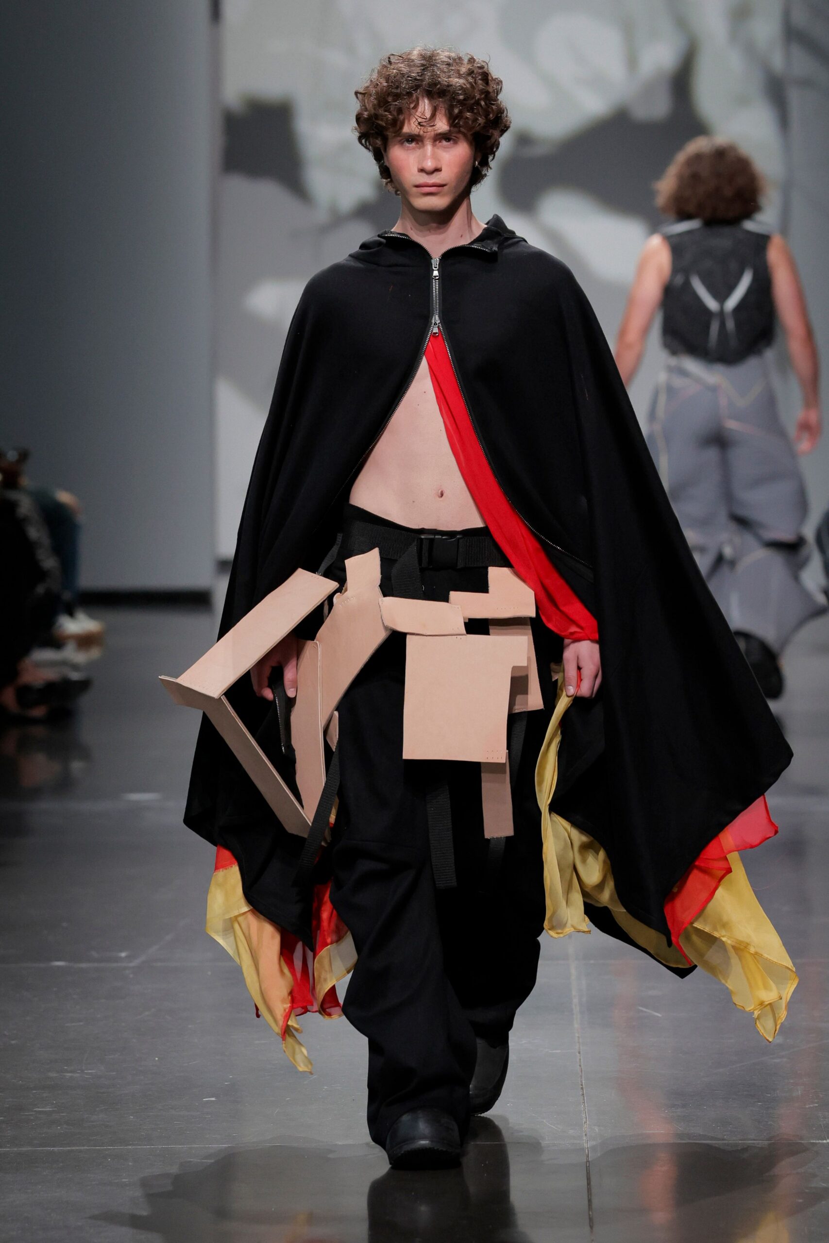 black cape with cargo pants