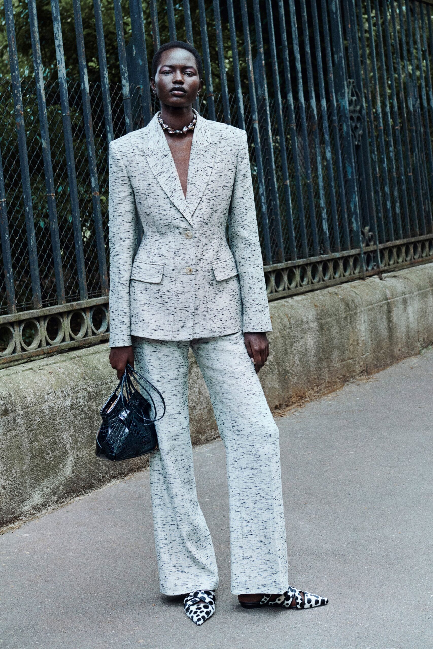 gray tailored suit with animal-print shoes