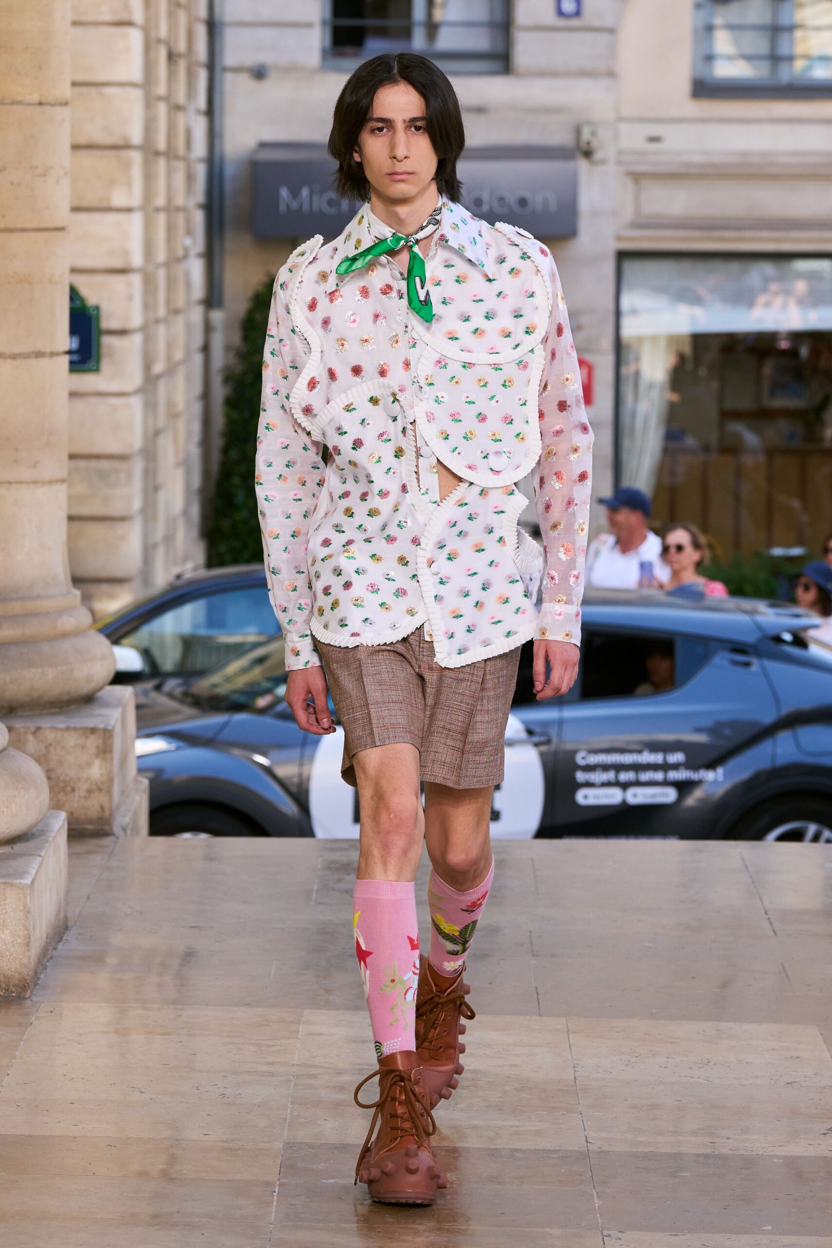 white printed shirt with brown shorts
