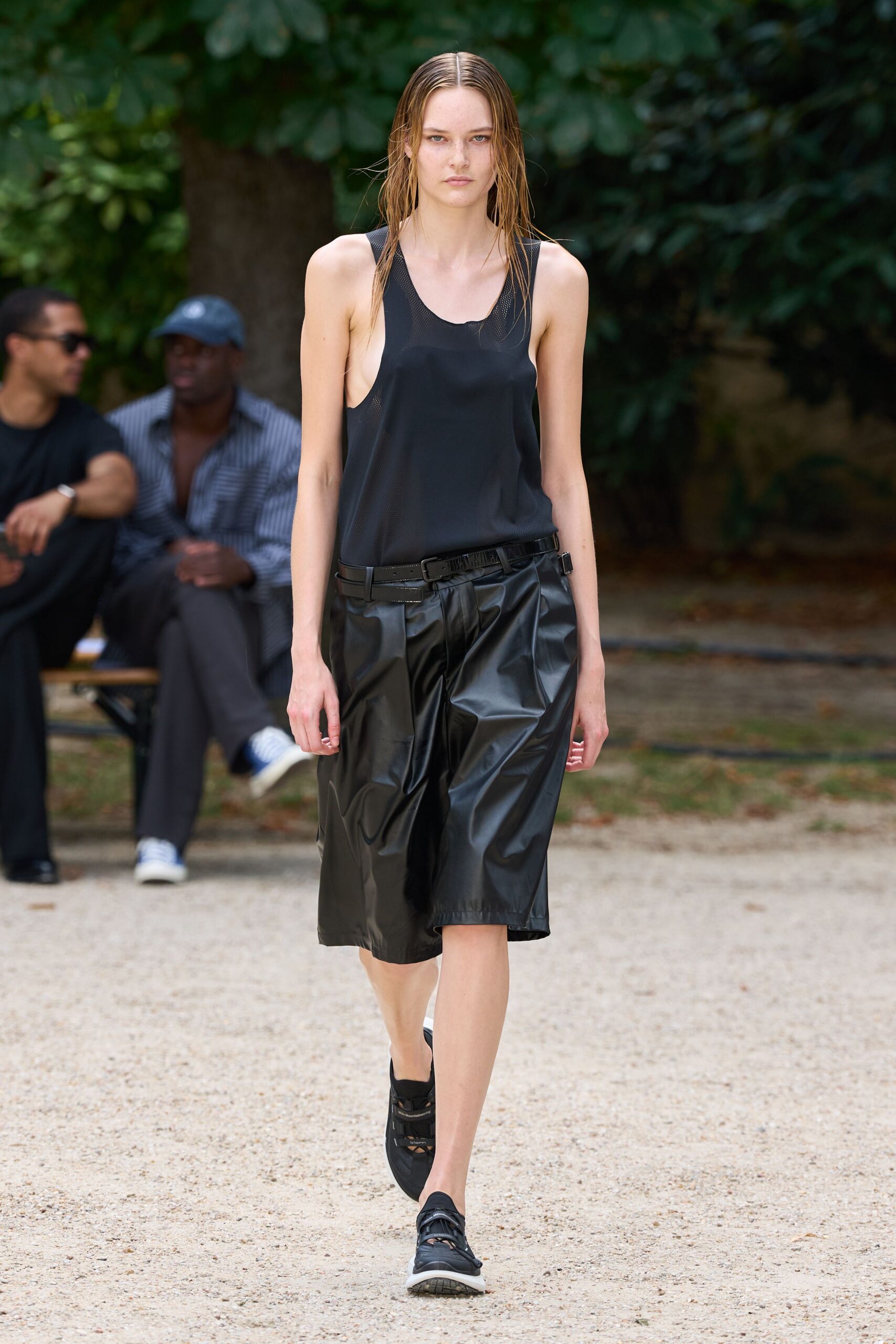black silk tank-top and leather shorts