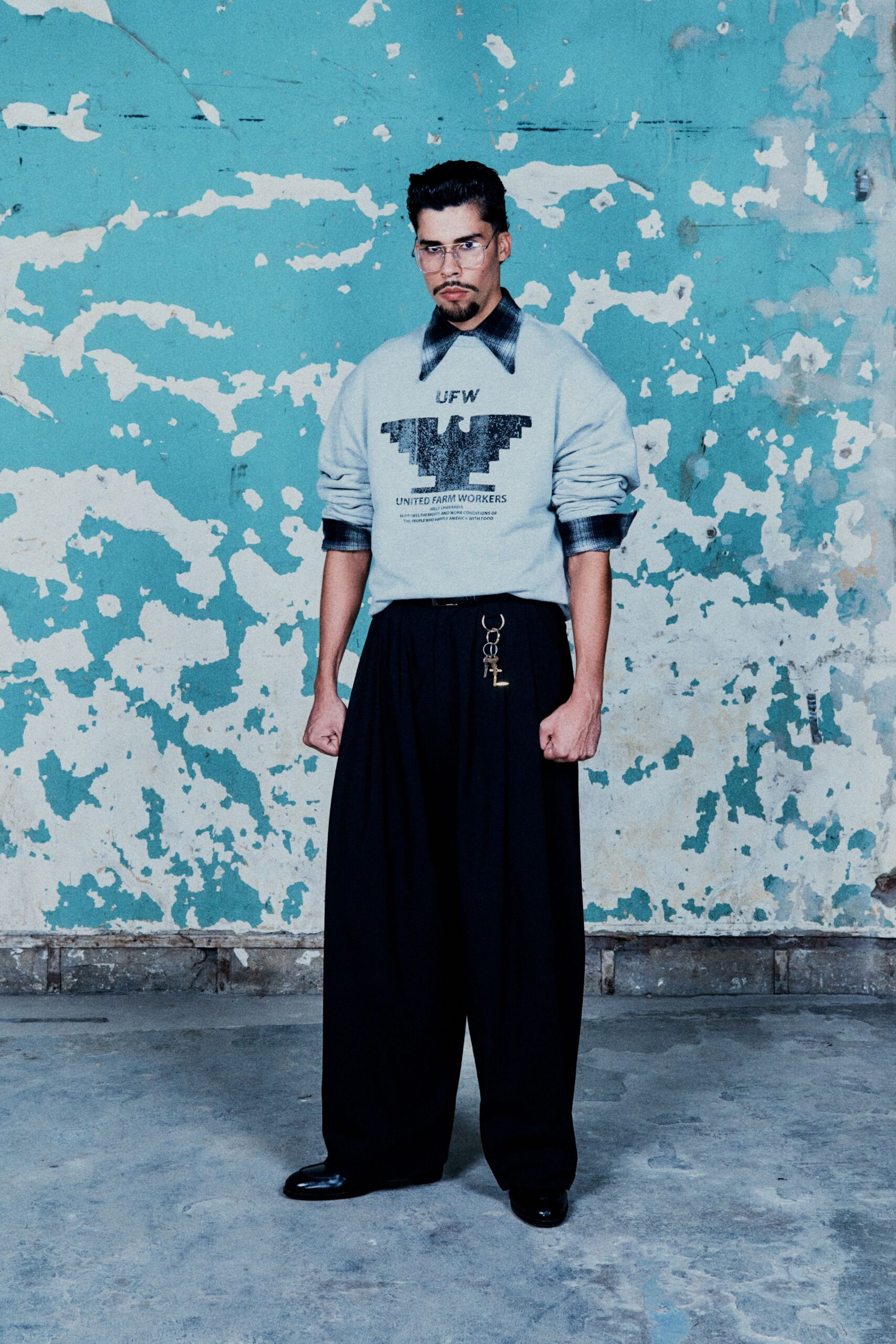 gray relaxed sweater with black pants