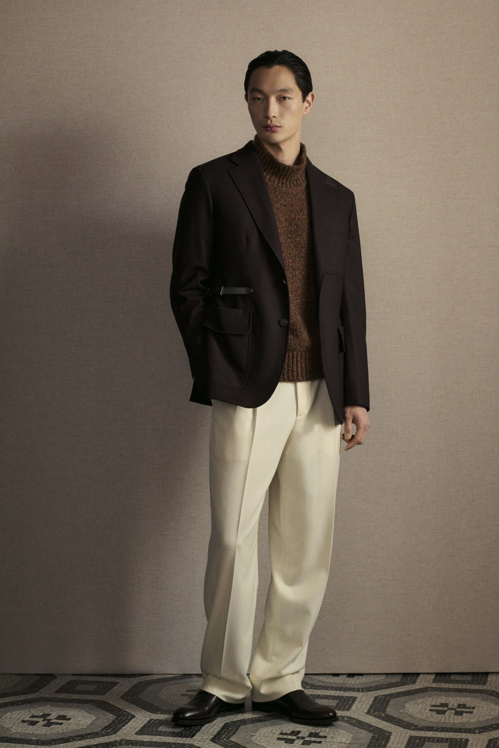 black blazer brown sweater white pants