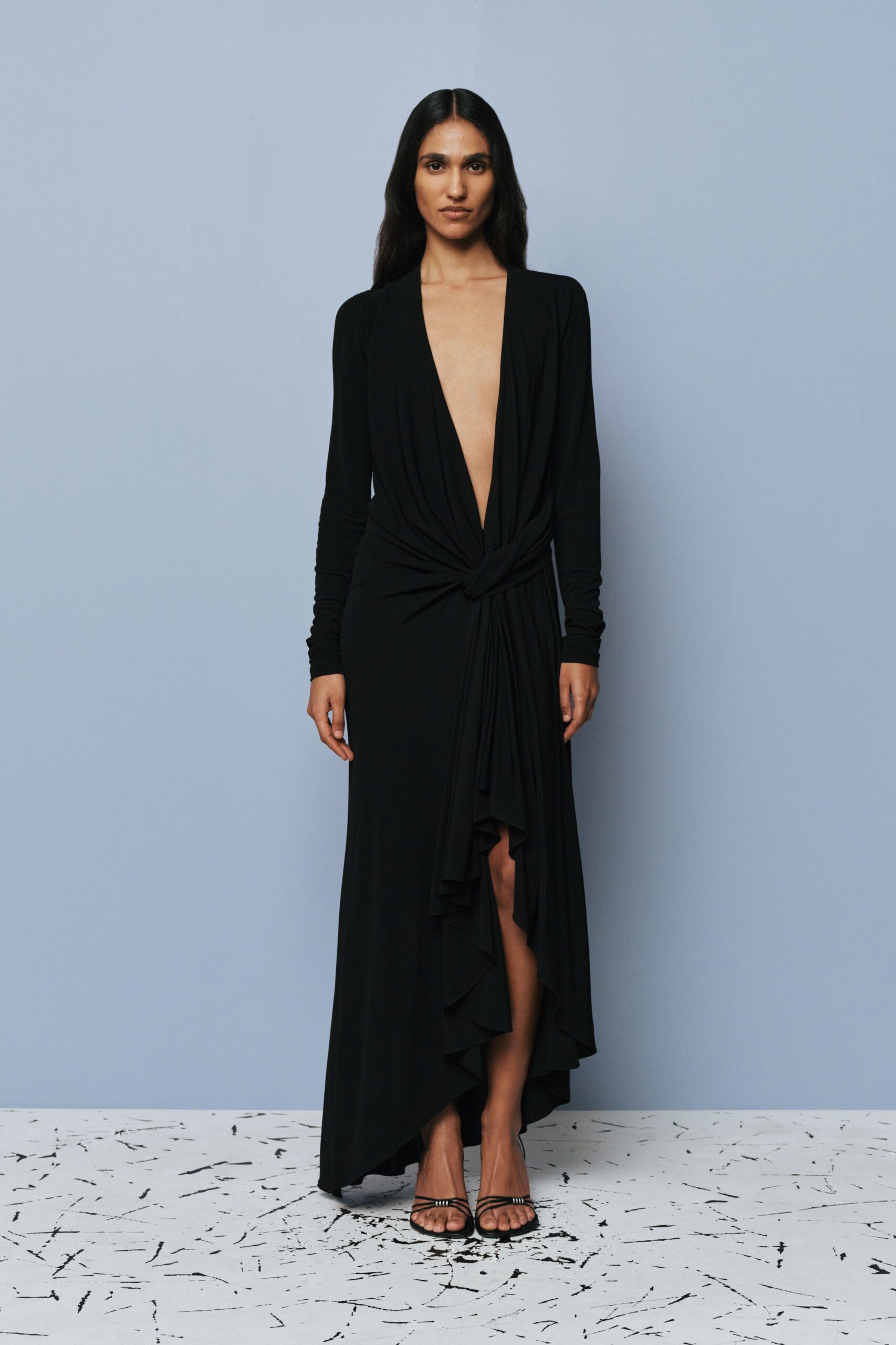 black fitted wrap dress with strappy shoes