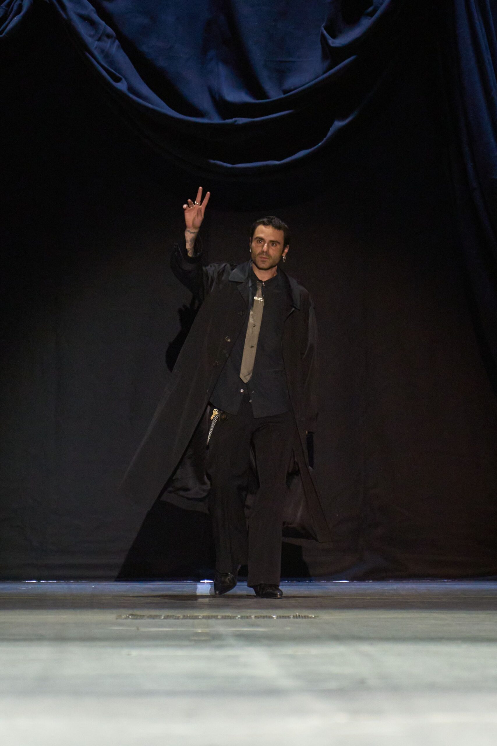 black coat with relaxed pants