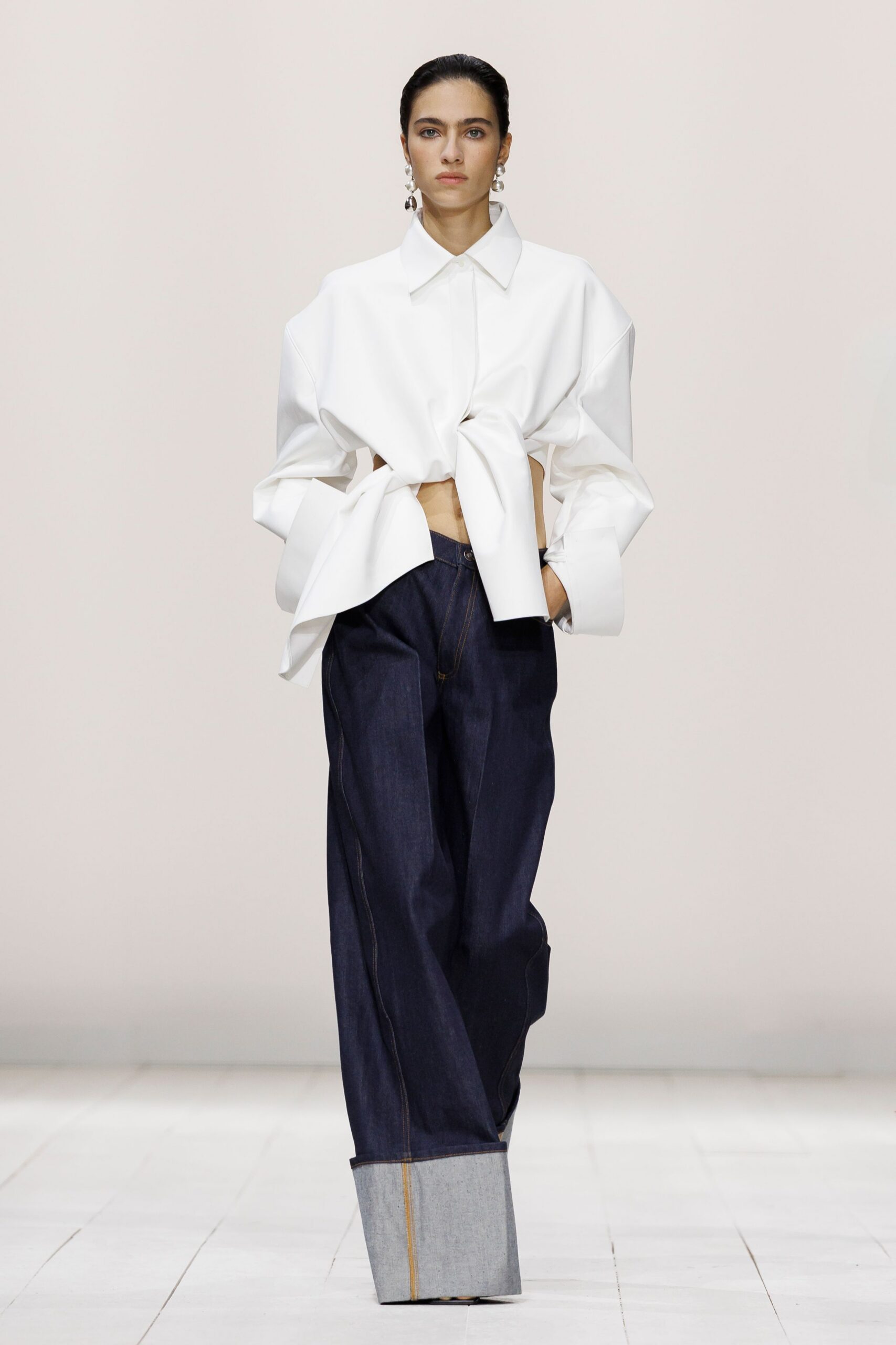 oversized white shirt and blue denim pants