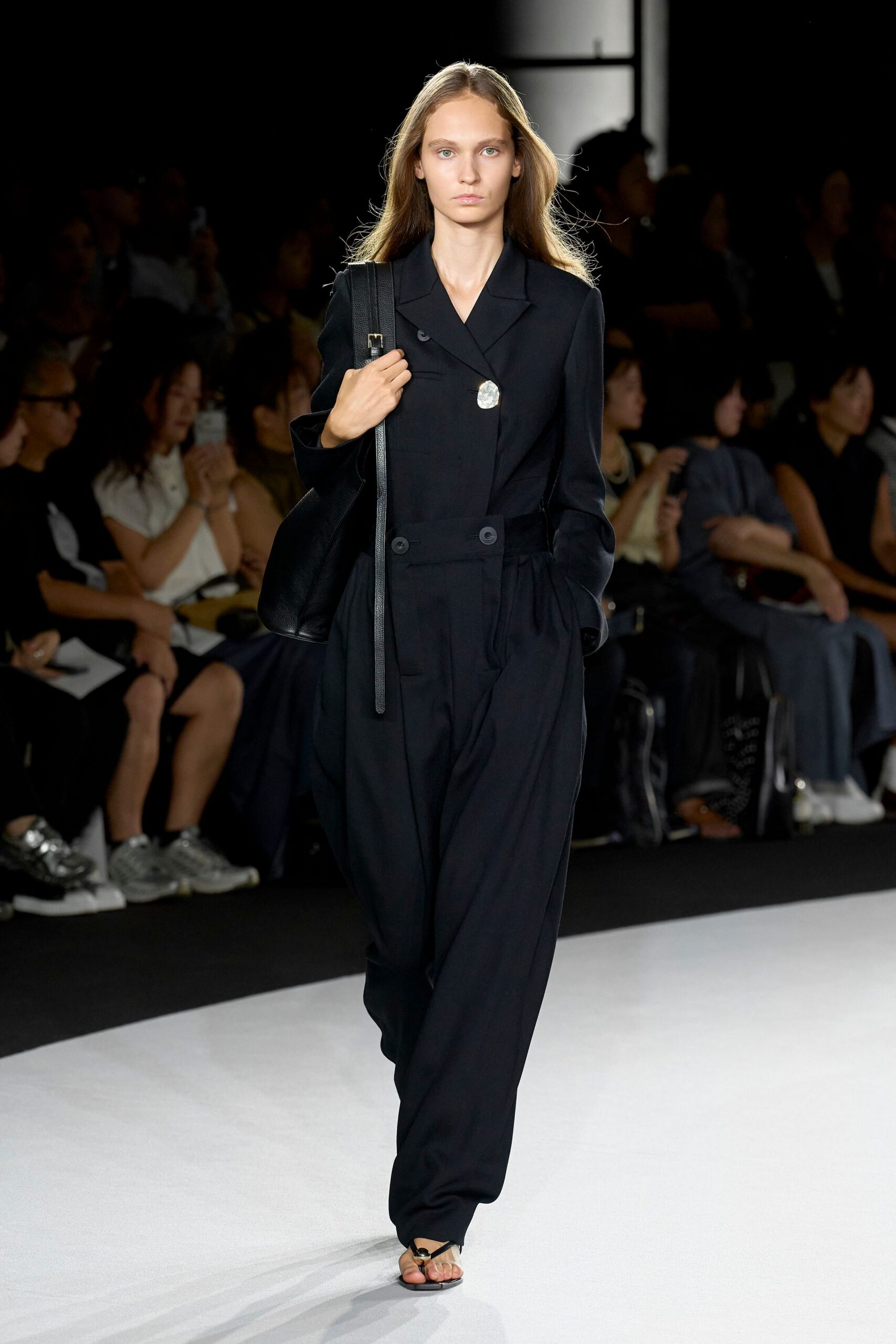 black relaxed jumpsuit with strappy shoes