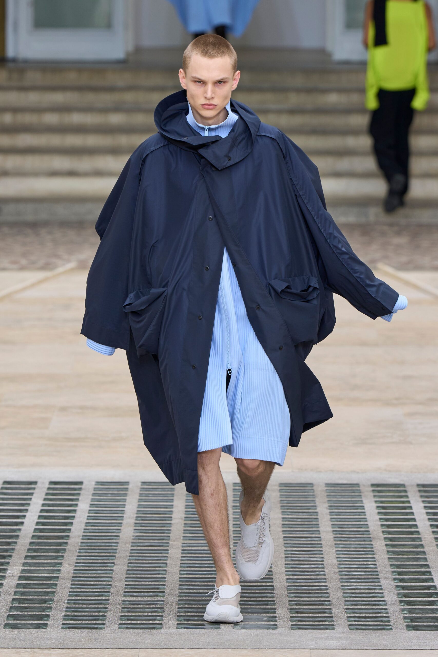 blue oversized coat with relaxed shirt and shorts