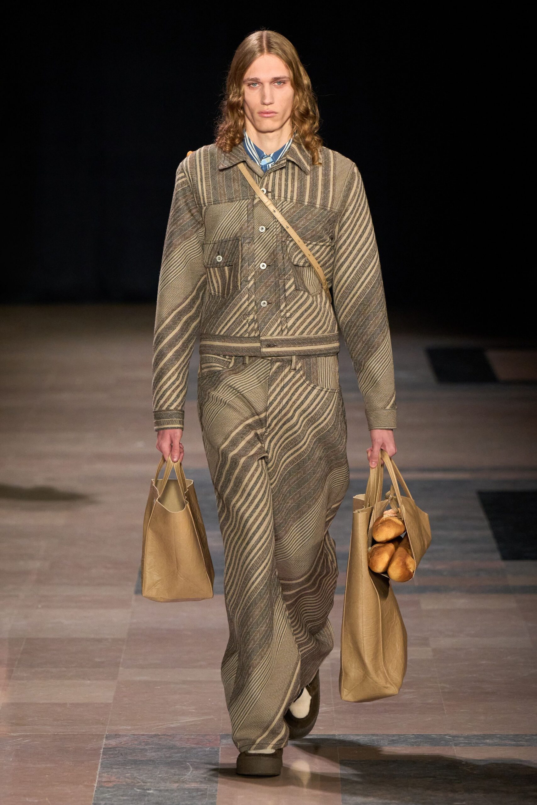 brown striped suit with bags