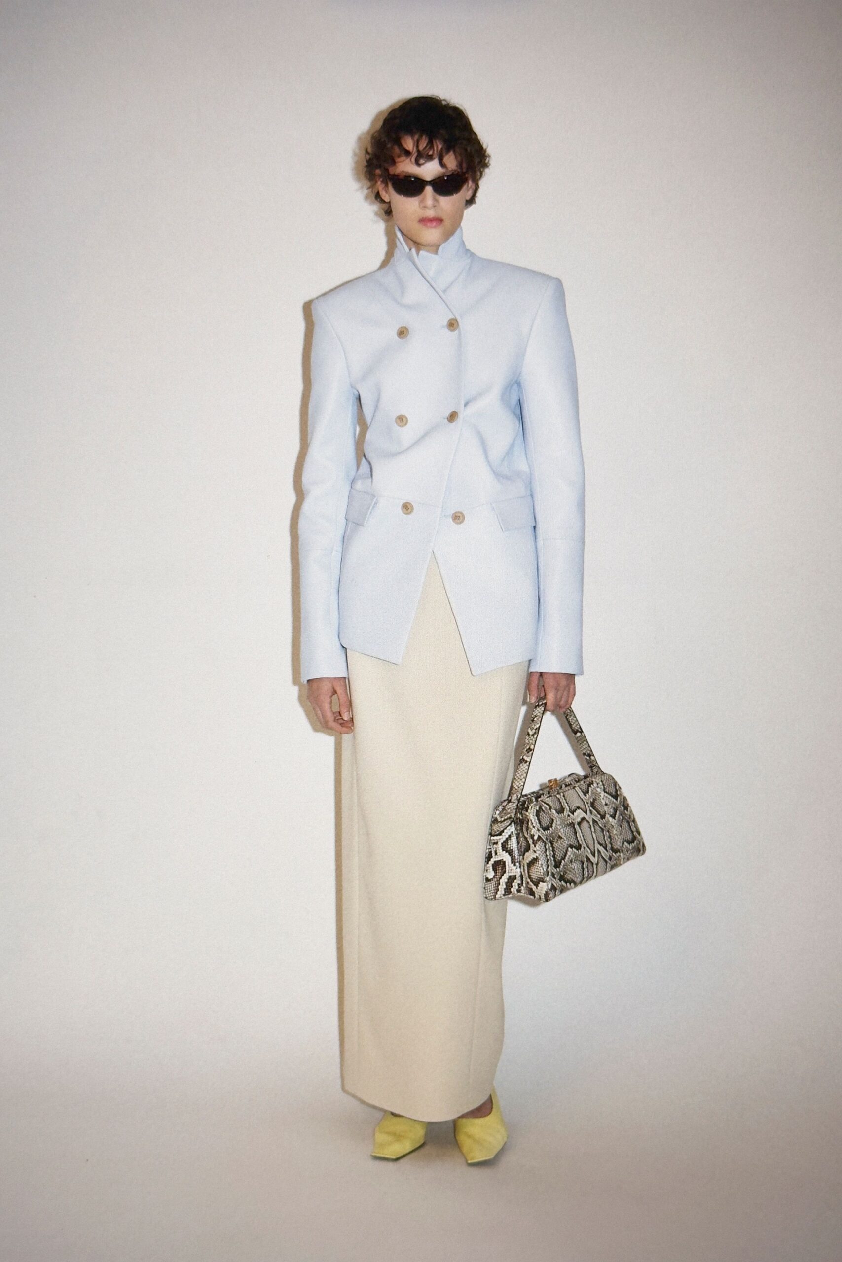 light blue tailored blazer with beige skirt