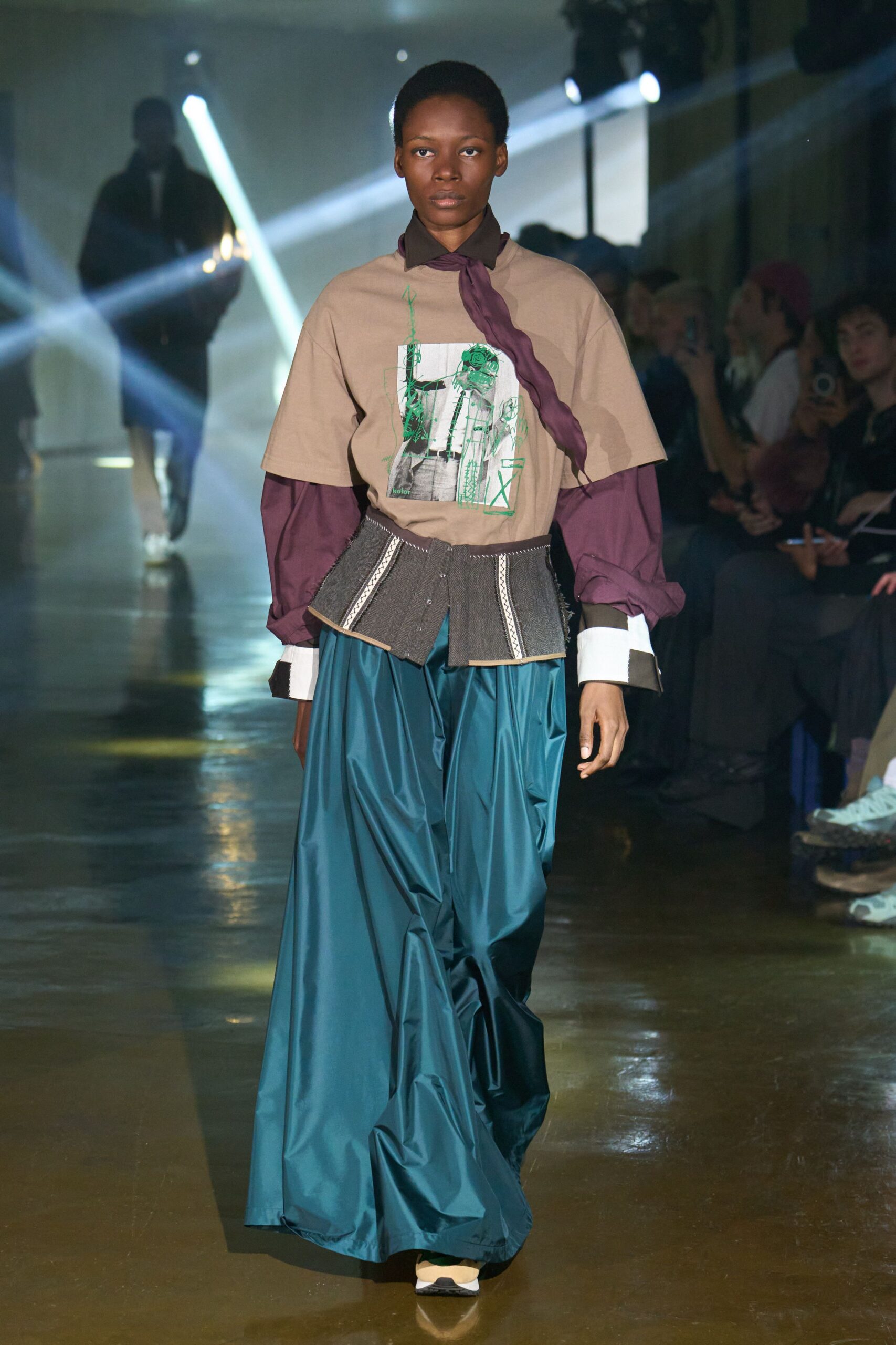 beige top with teal pants
