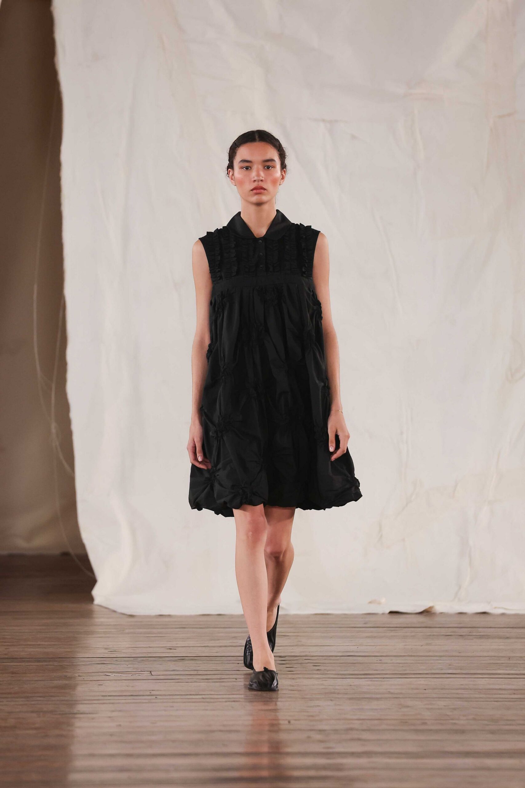 black pleated mini dress