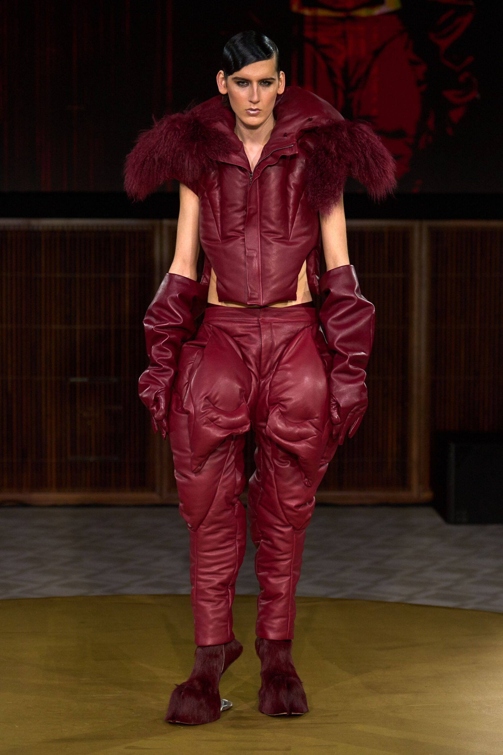 red leather long-sleeve collared fitted padded jumpsuit