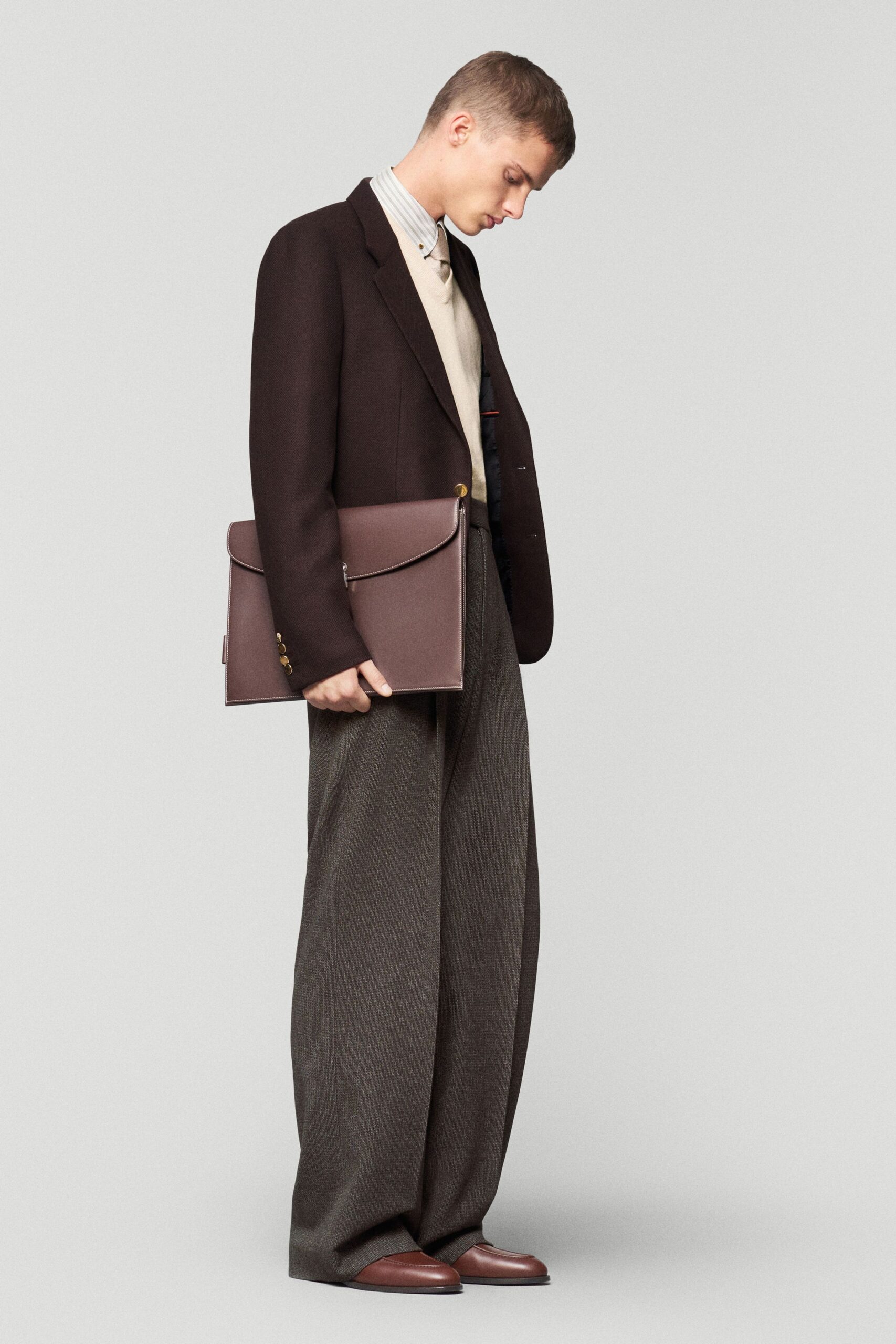 black blazer beige sweater gray pants