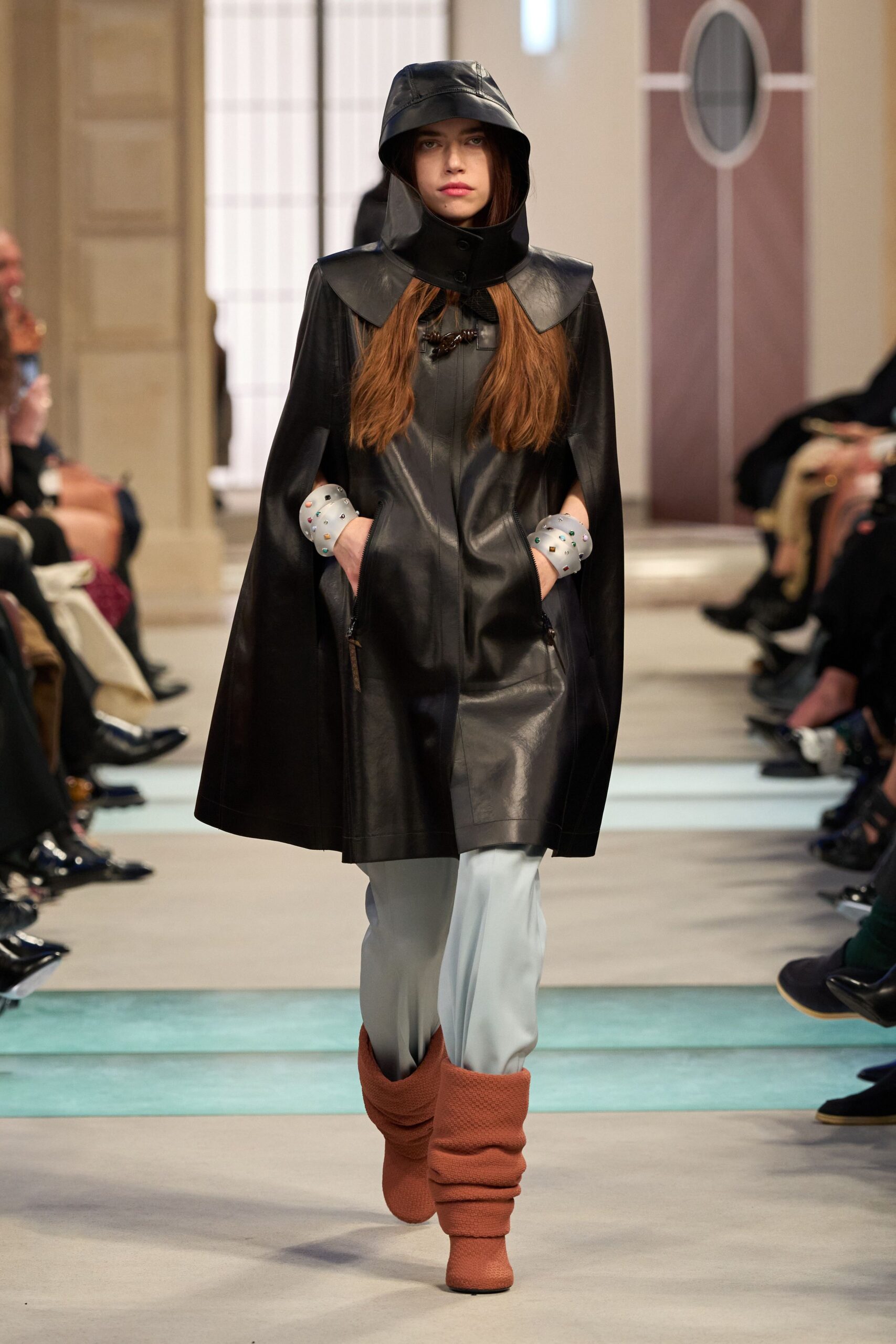 black leather cape with blue pants