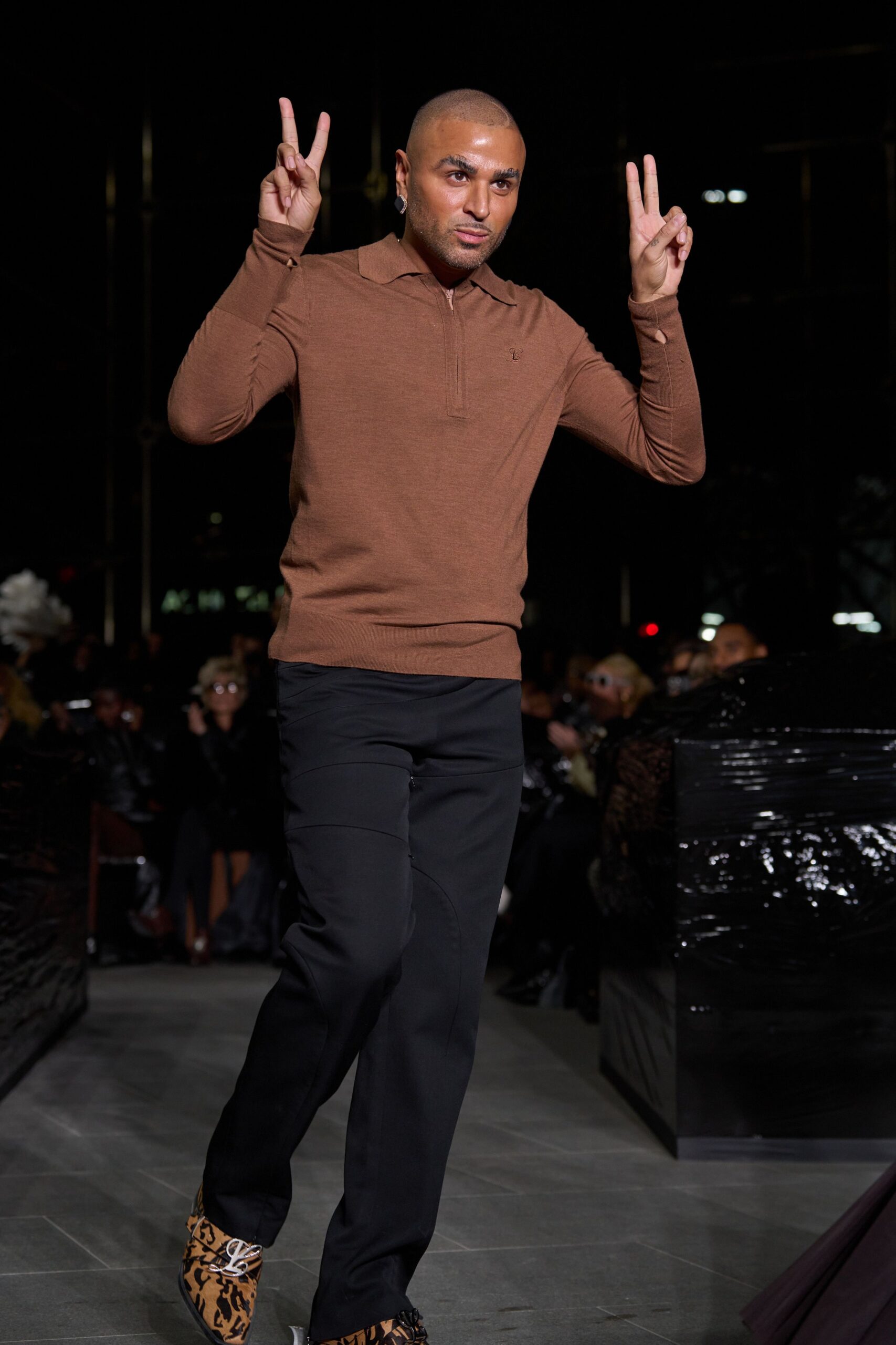 brown fitted top with black pants