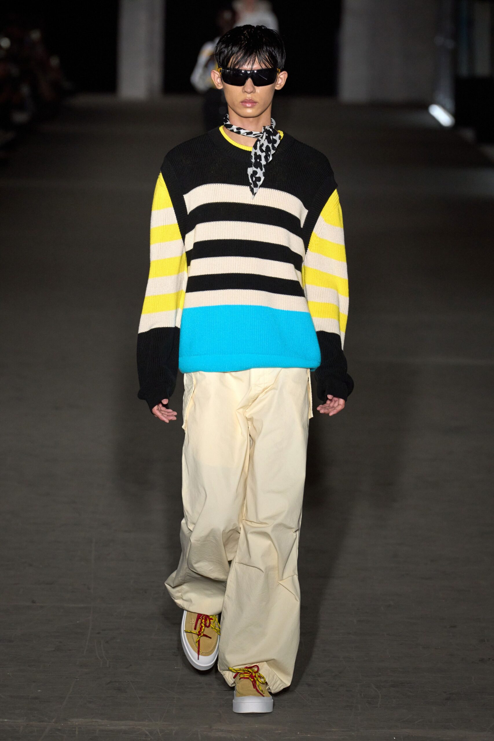 striped sweater and beige pants