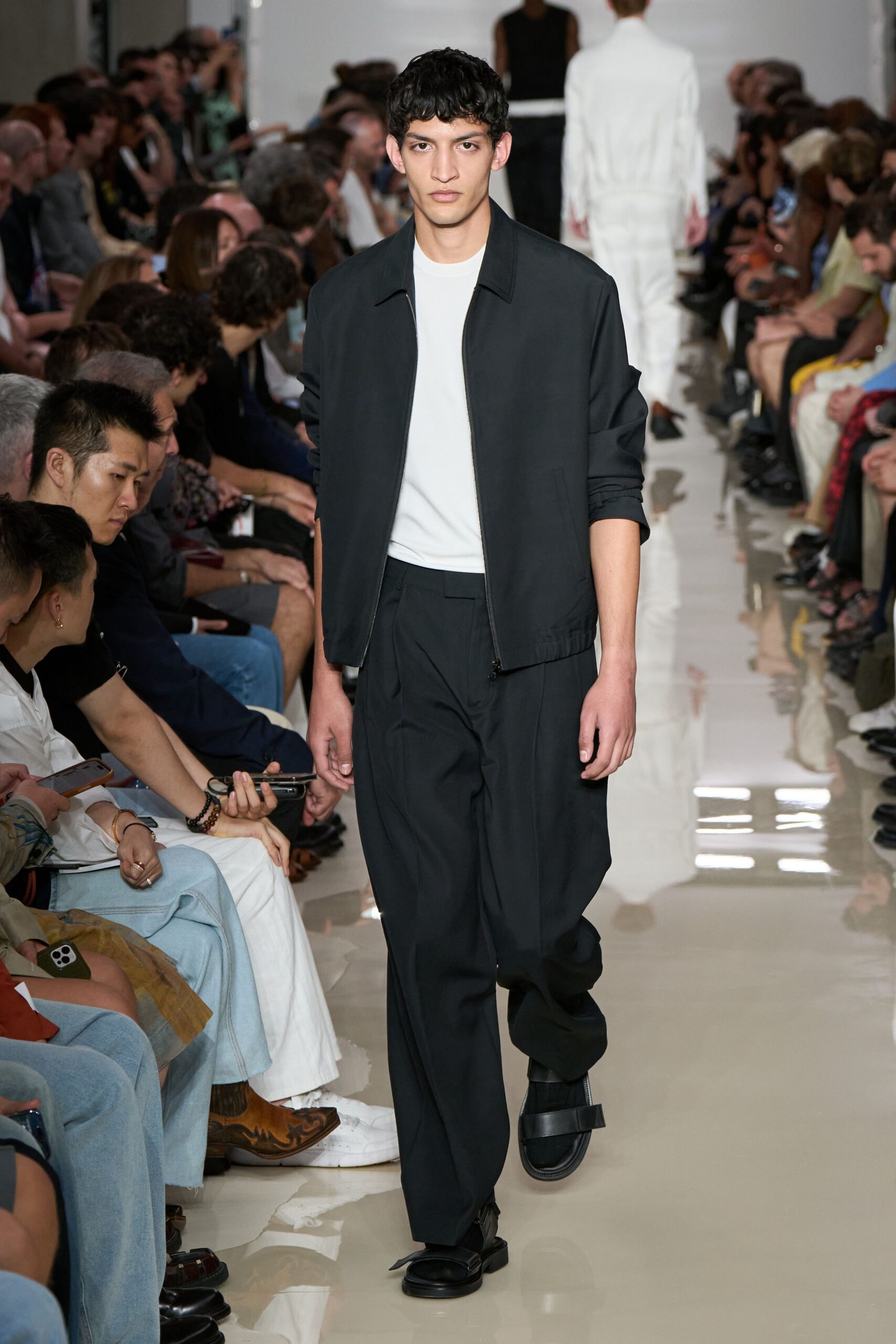 black jacket white t-shirt black pants