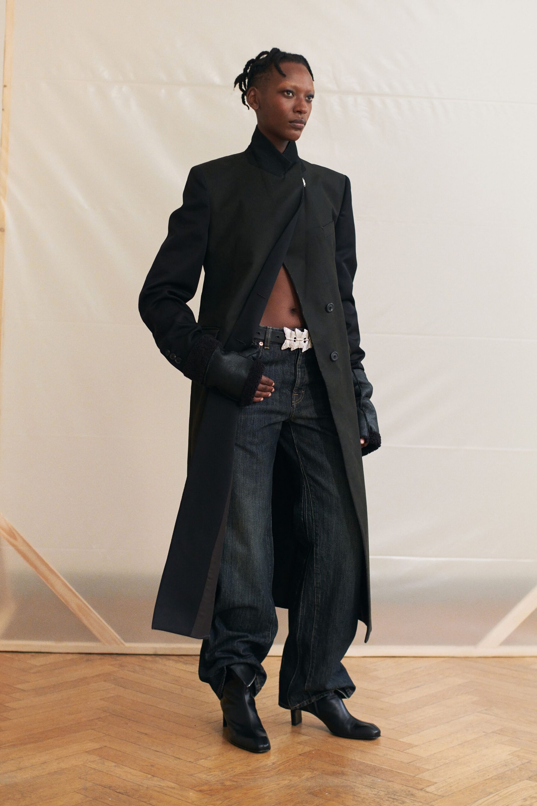 black wool coat with relaxed denim pants