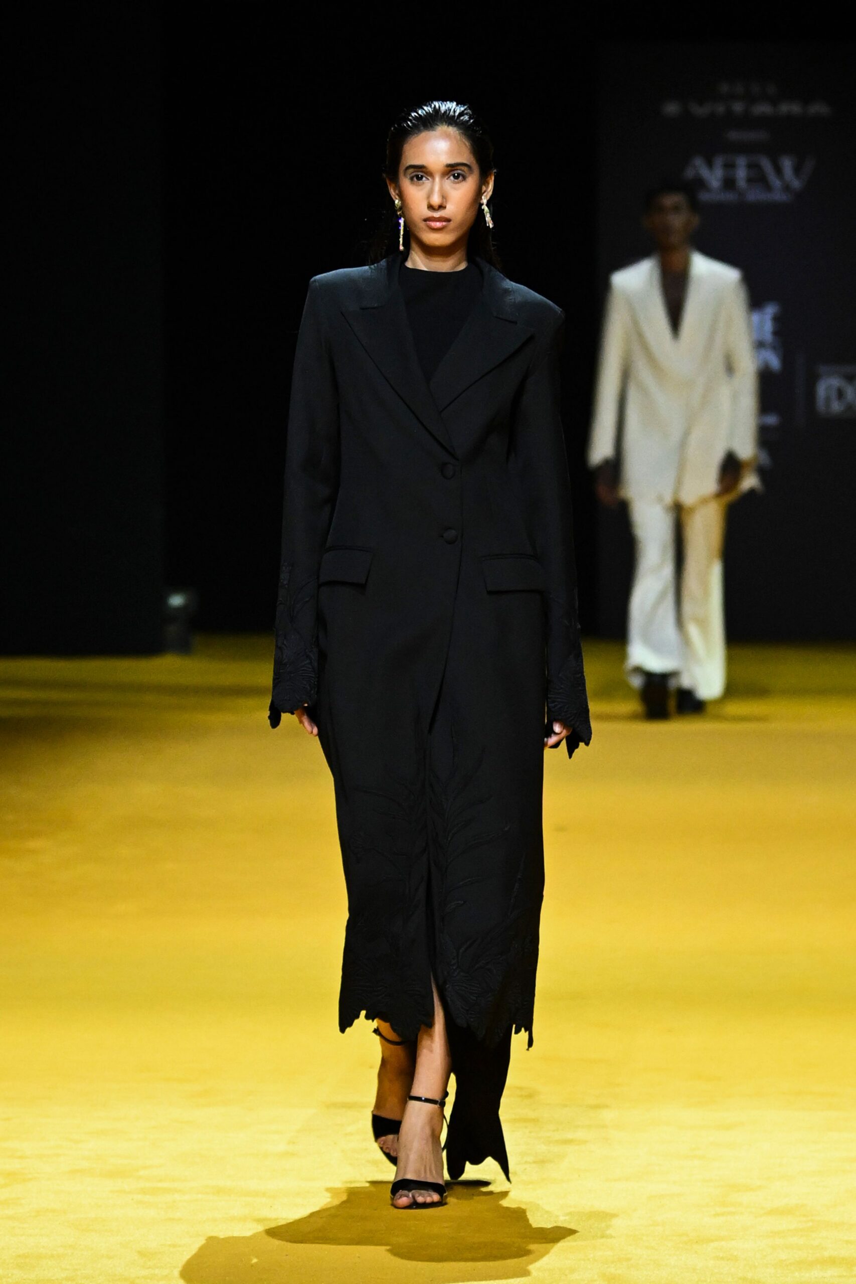 black fitted coat with heels
