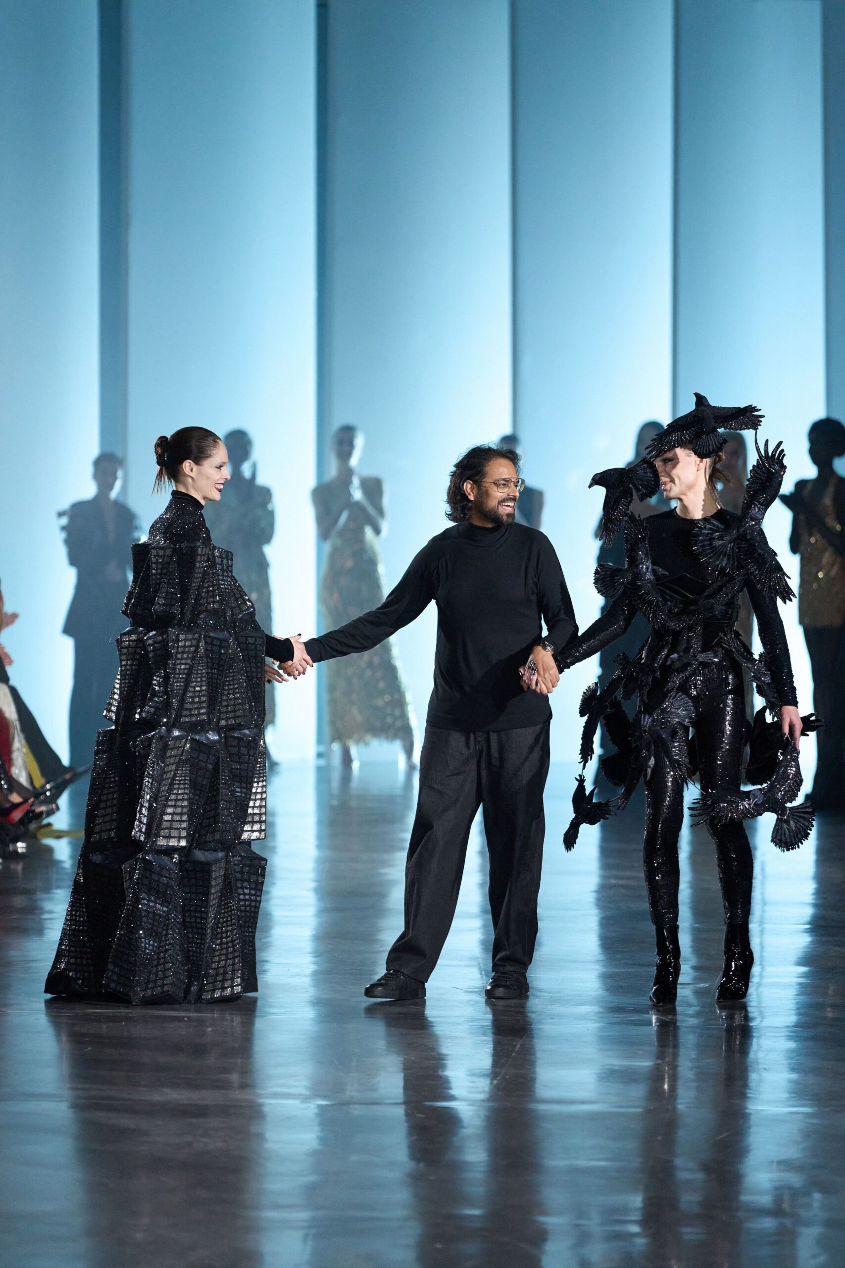 black silk pleated gown and leather jacket