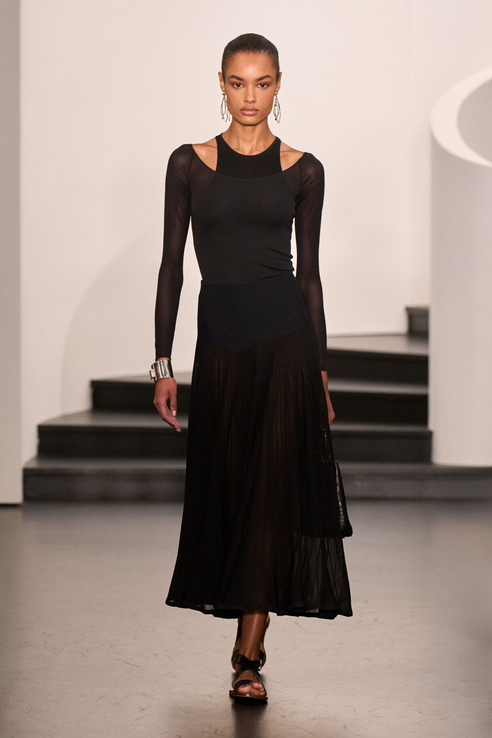 black fitted top and midi skirt