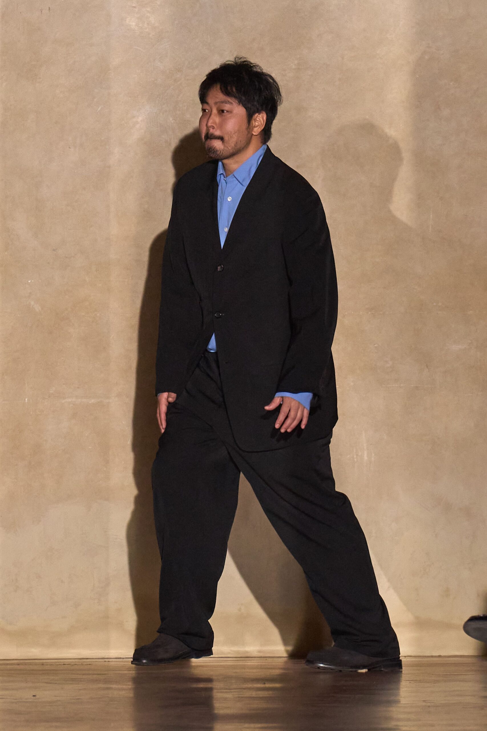 black suit with blue shirt