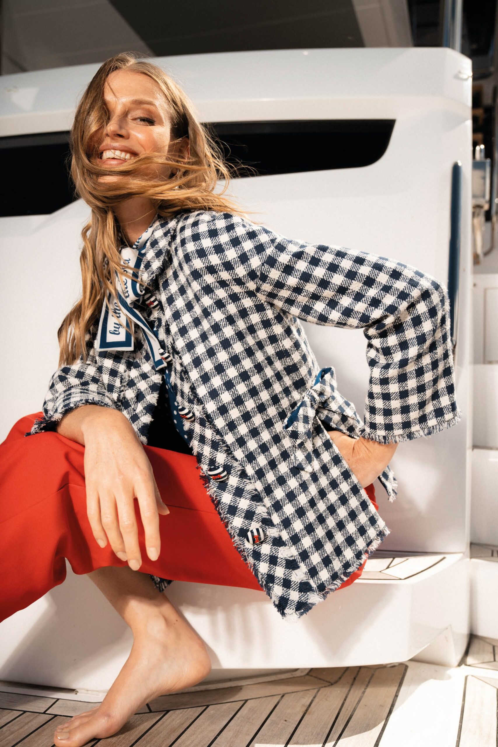 blue and white checked jacket with red pants