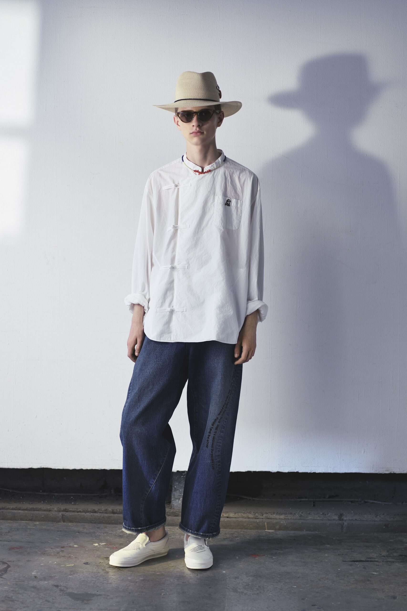 white relaxed shirt with blue denim pants