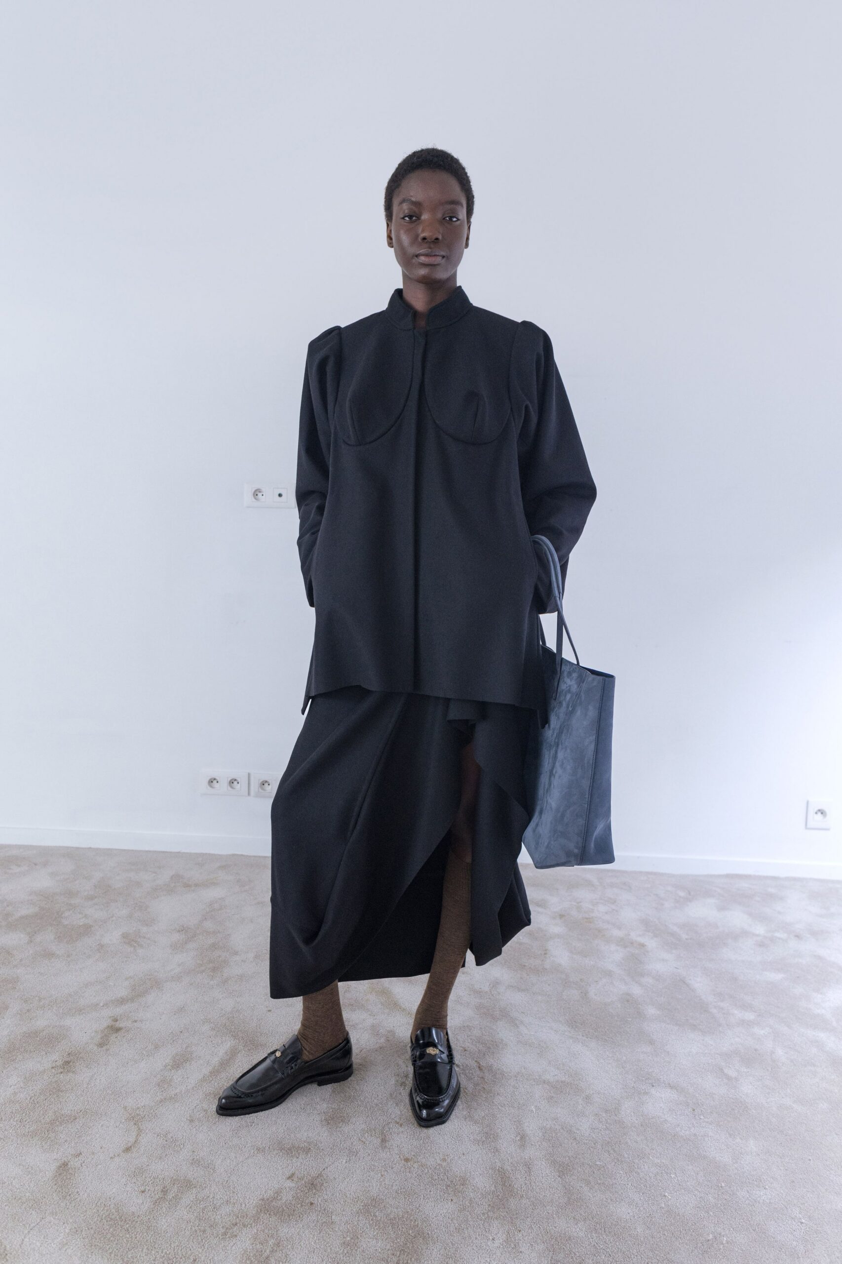 black relaxed top with asymmetric skirt