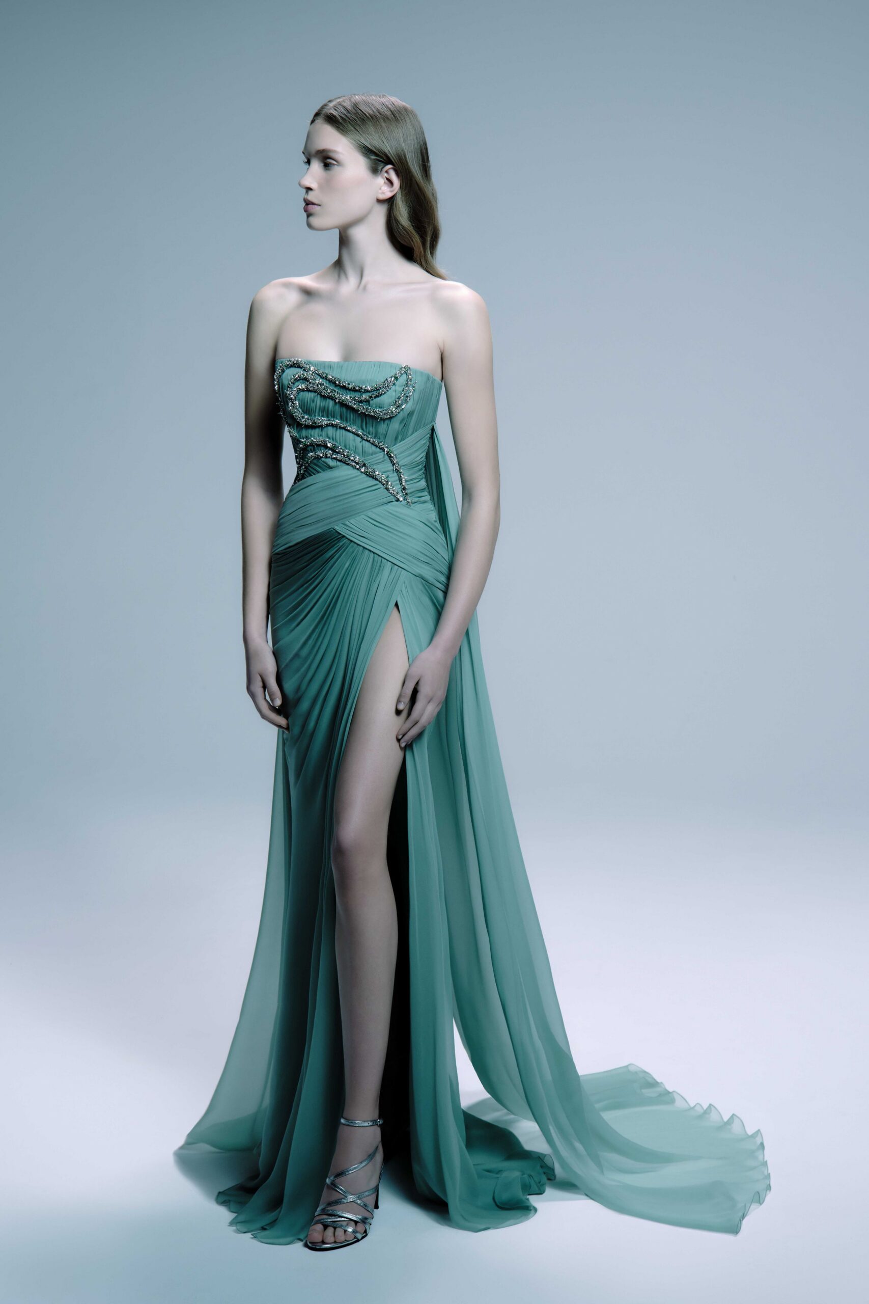 green silk strapless high-neck fitted draped beaded gown