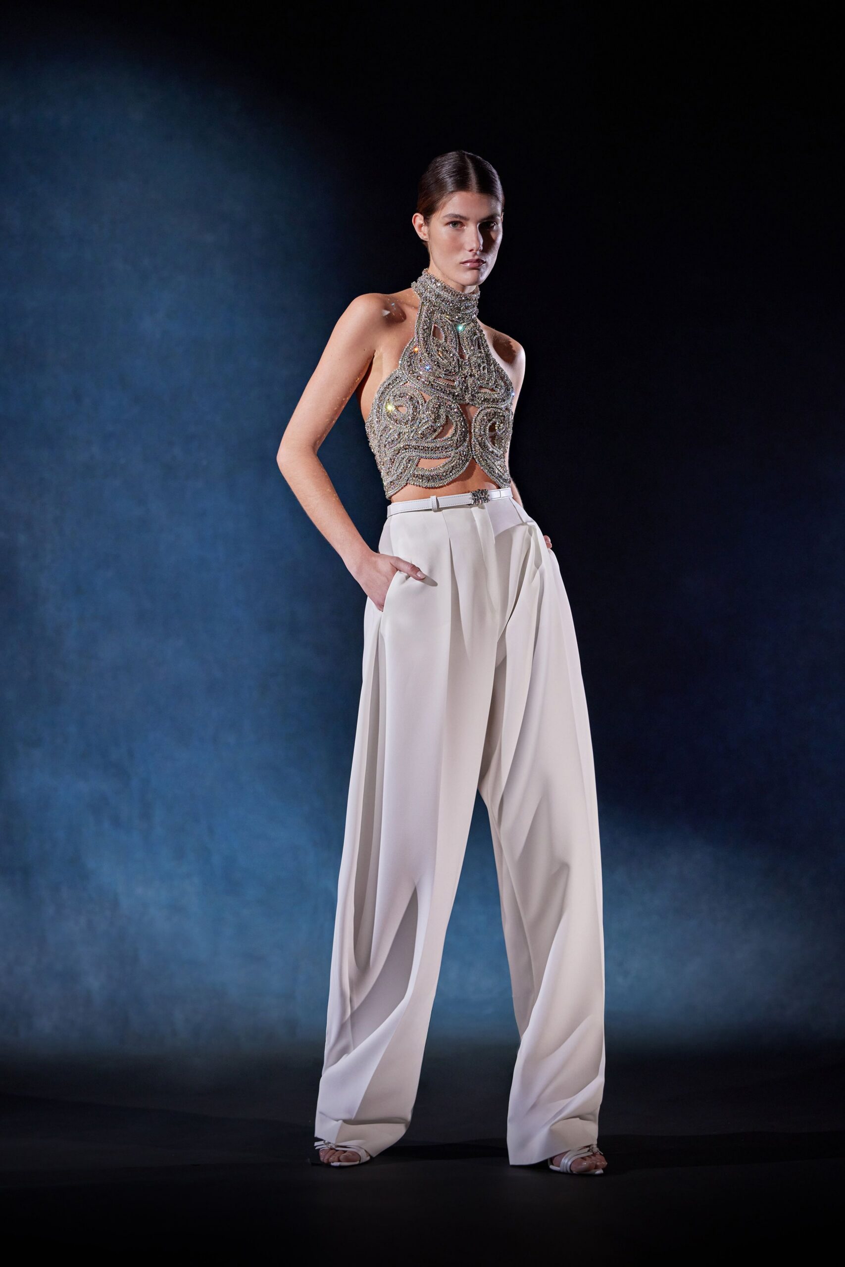 beige embellished top with white pants