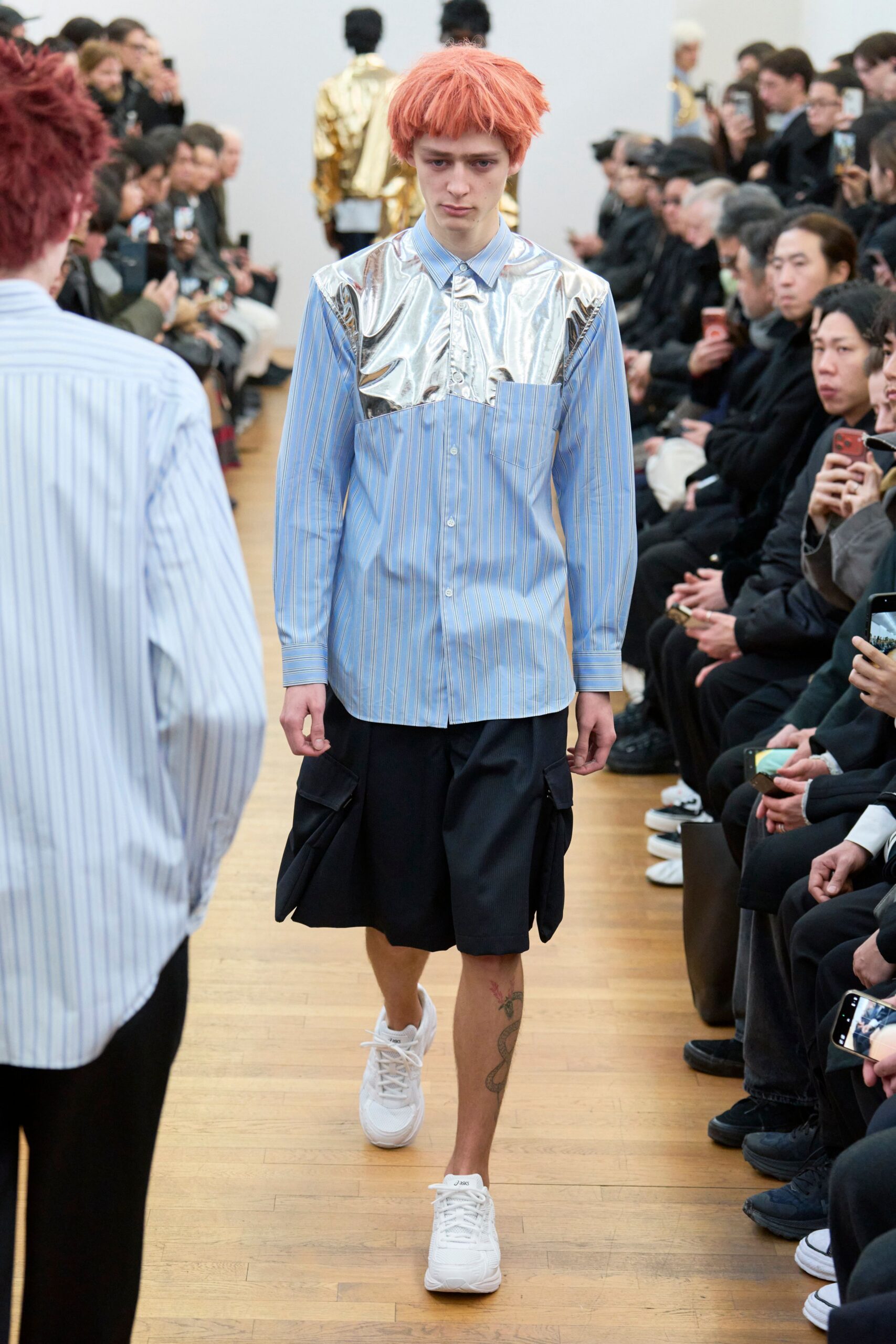blue striped shirt with black shorts