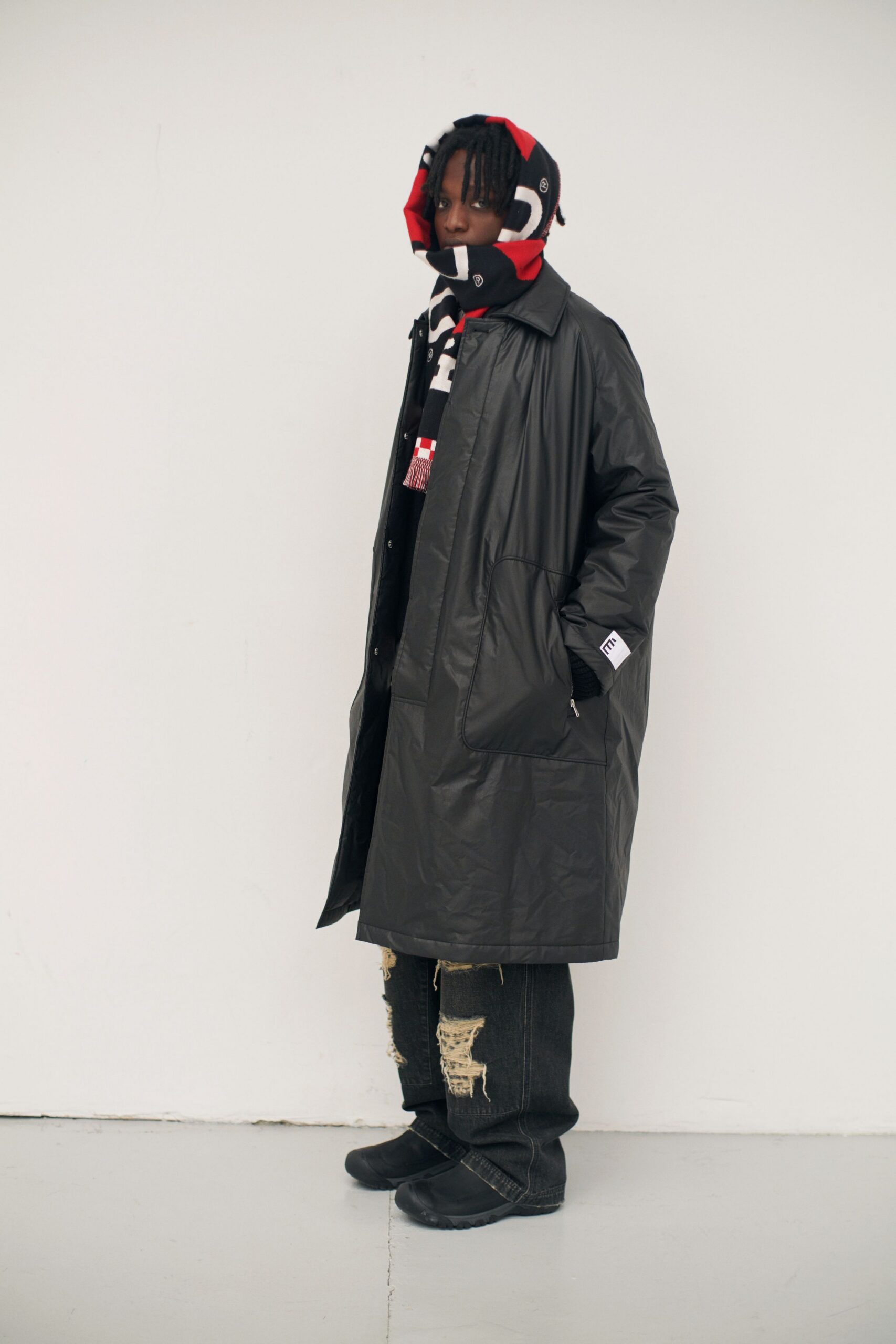black vinyl coat with scarf