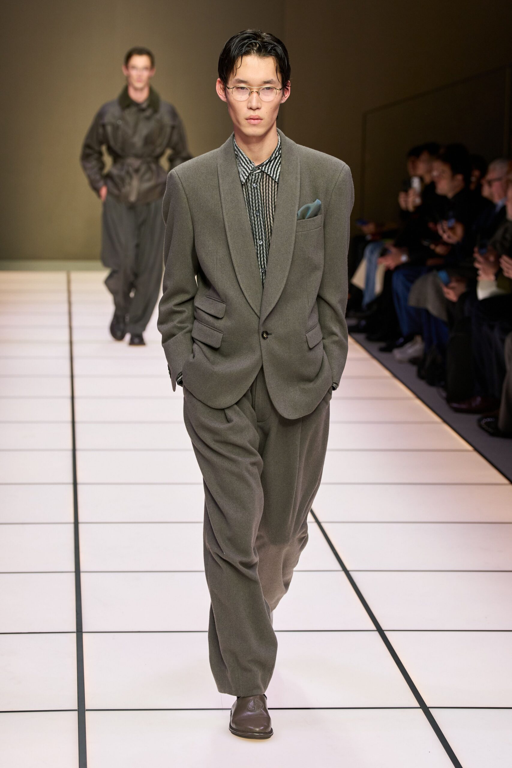 gray tailored suit with black shirt