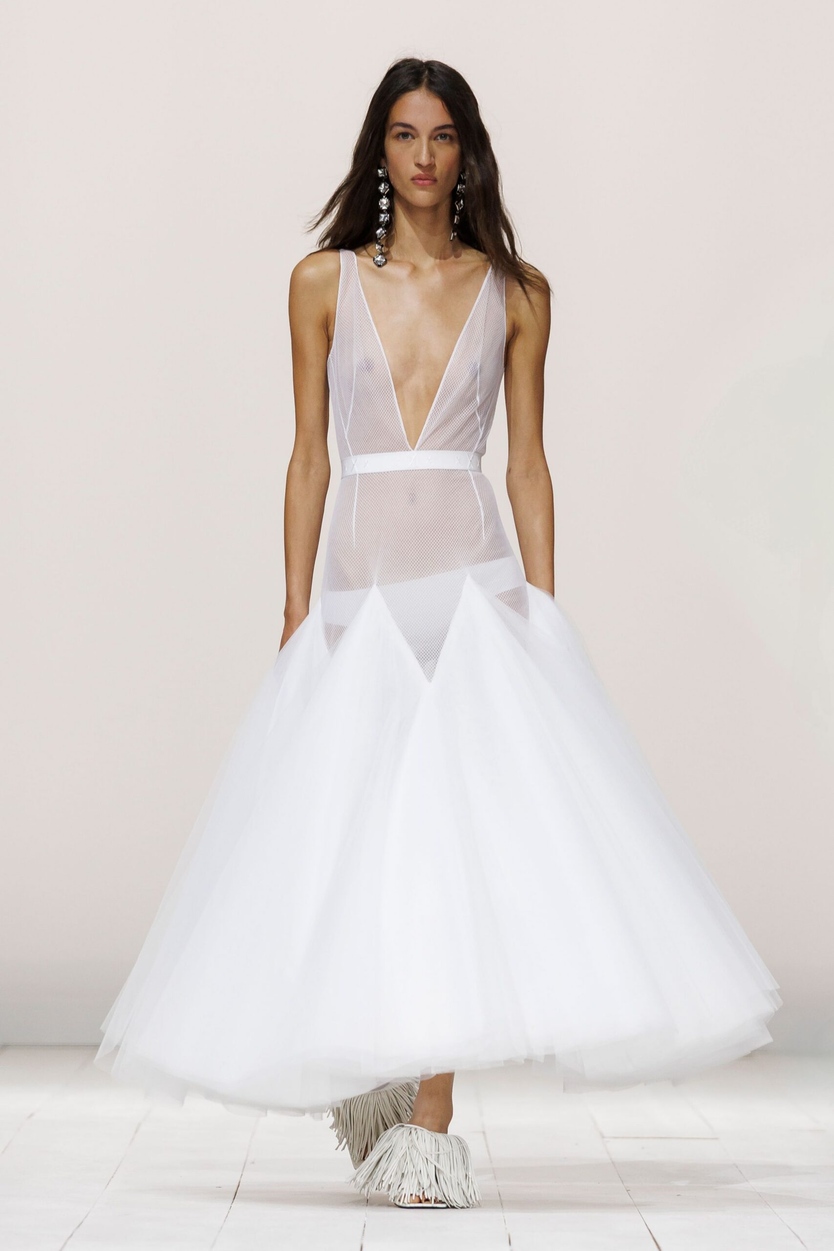 white tulle sleeveless v-neck fitted pleated layered gown