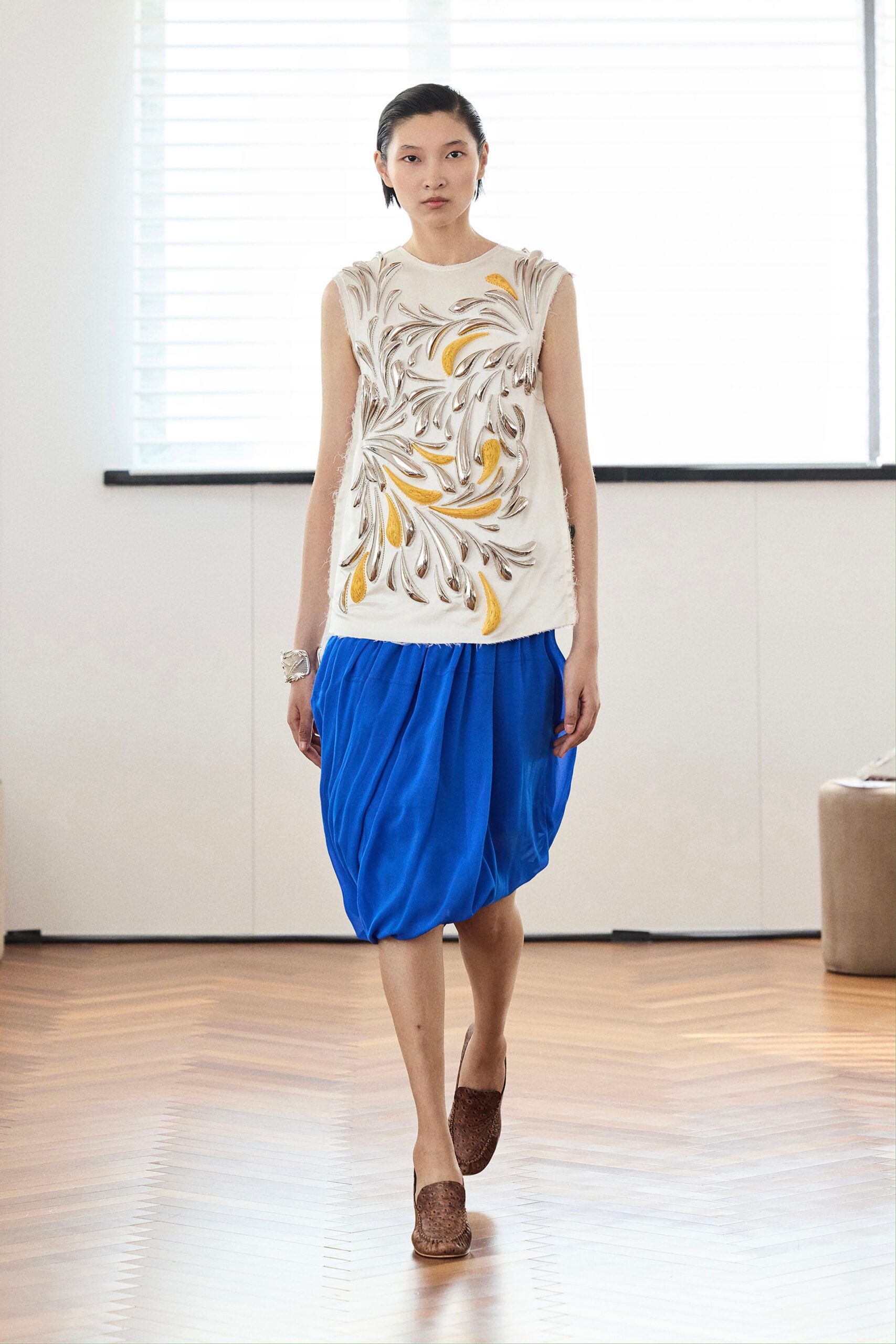 white embroidered top blue skirt