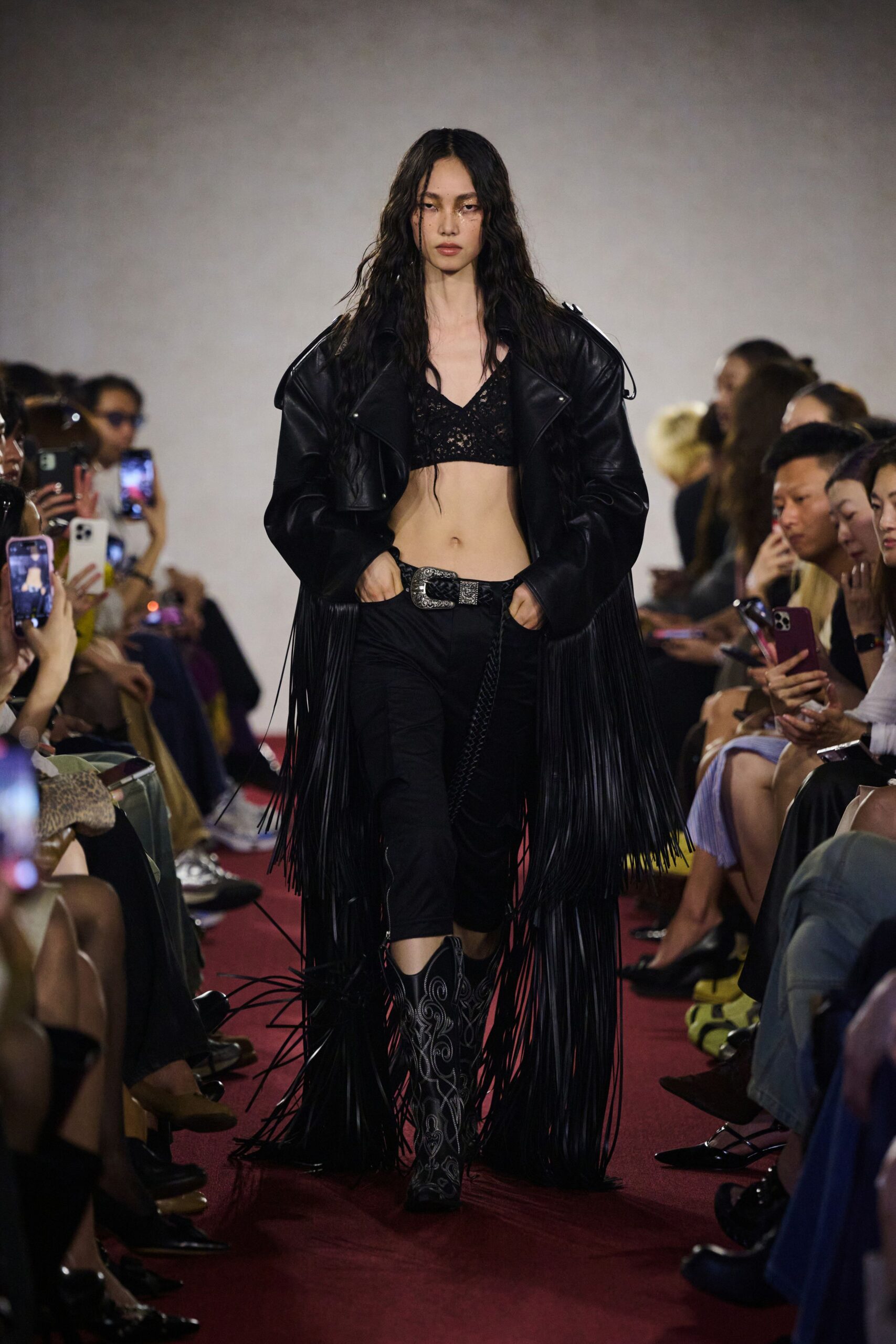 black leather fringed top with relaxed pants