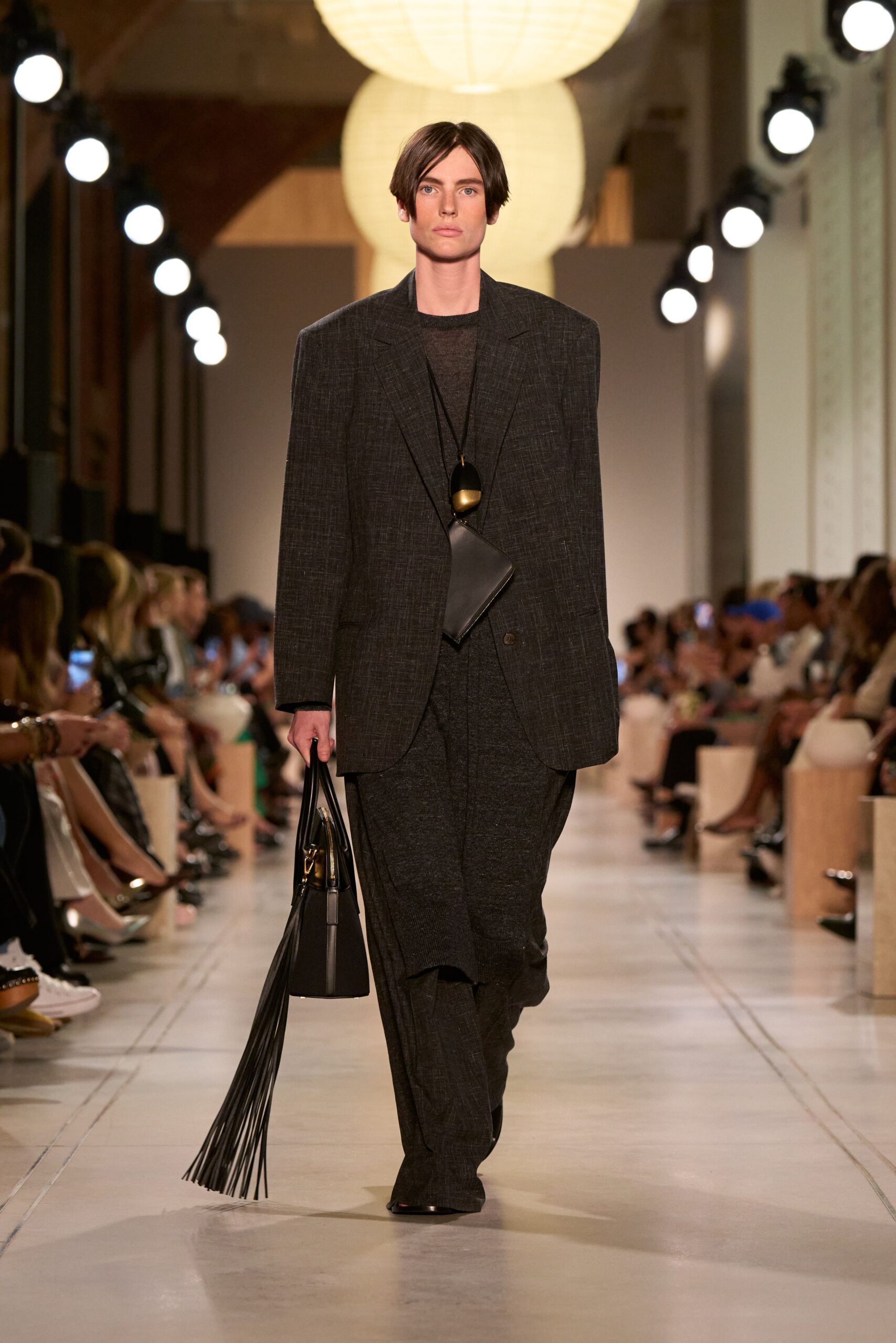 black tailored suit with bag