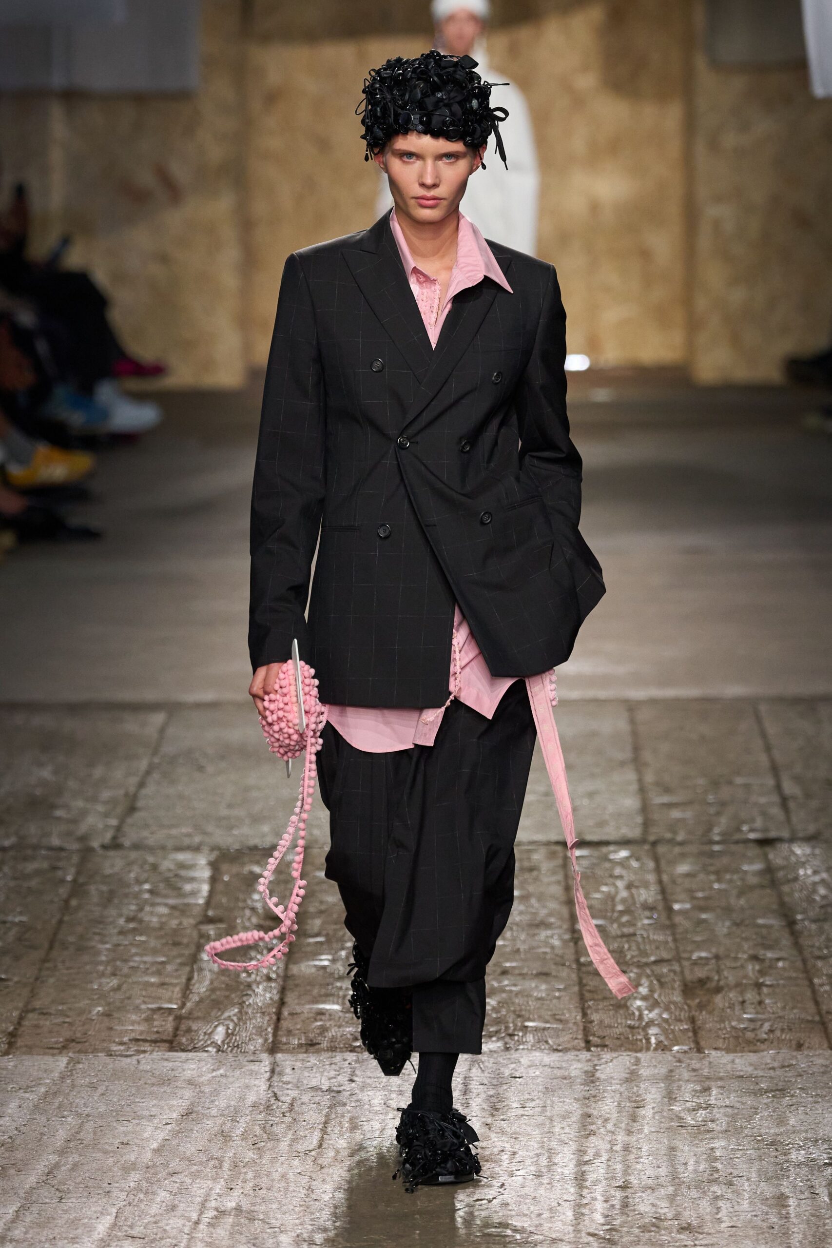 black tailored suit with pink shirt