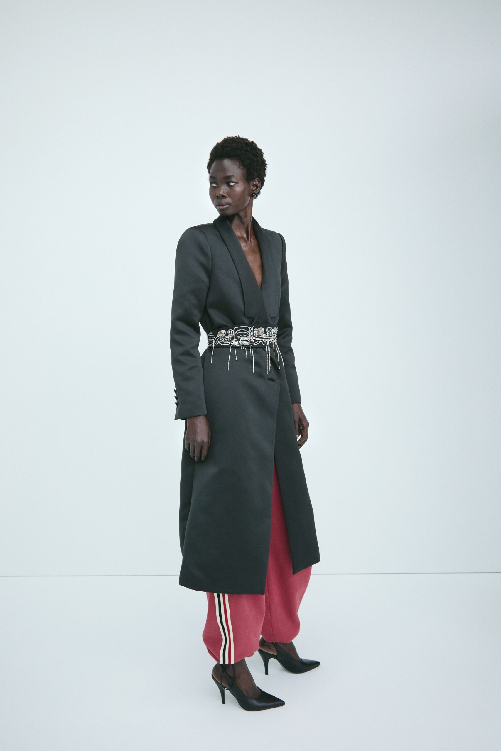 black coat red pants heels